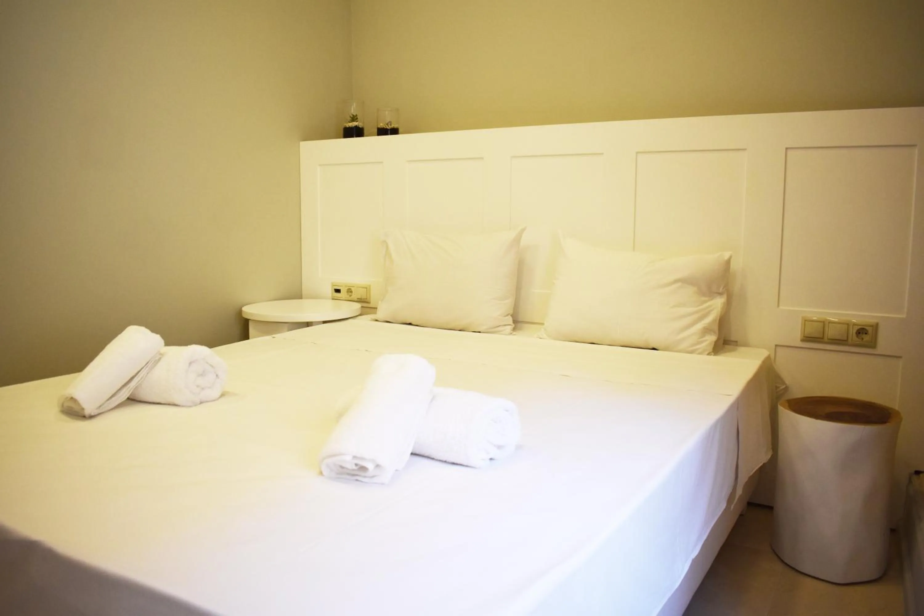 Bed in Candia Suites & Rooms
