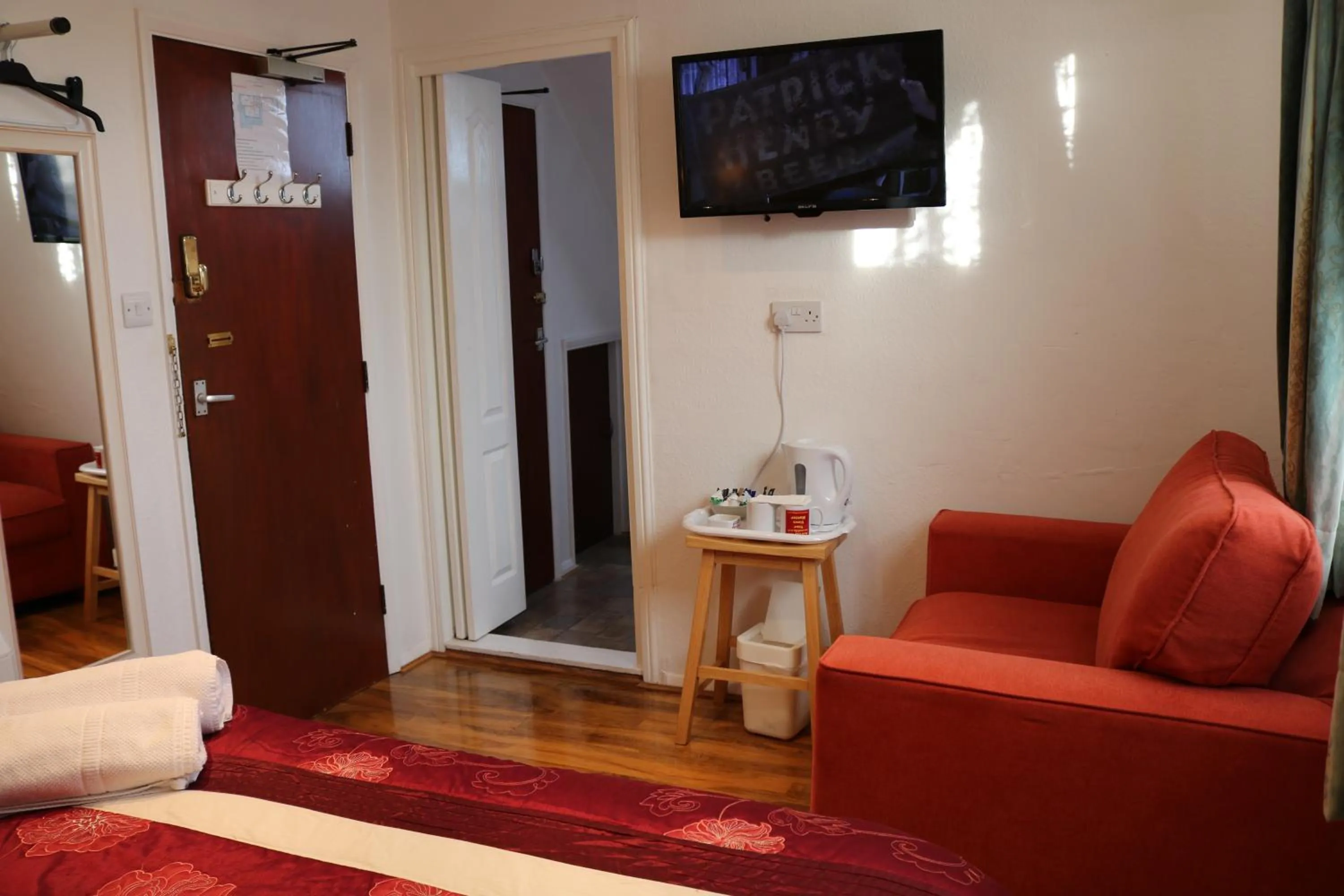 Seating area, Bed in Anand Lodge