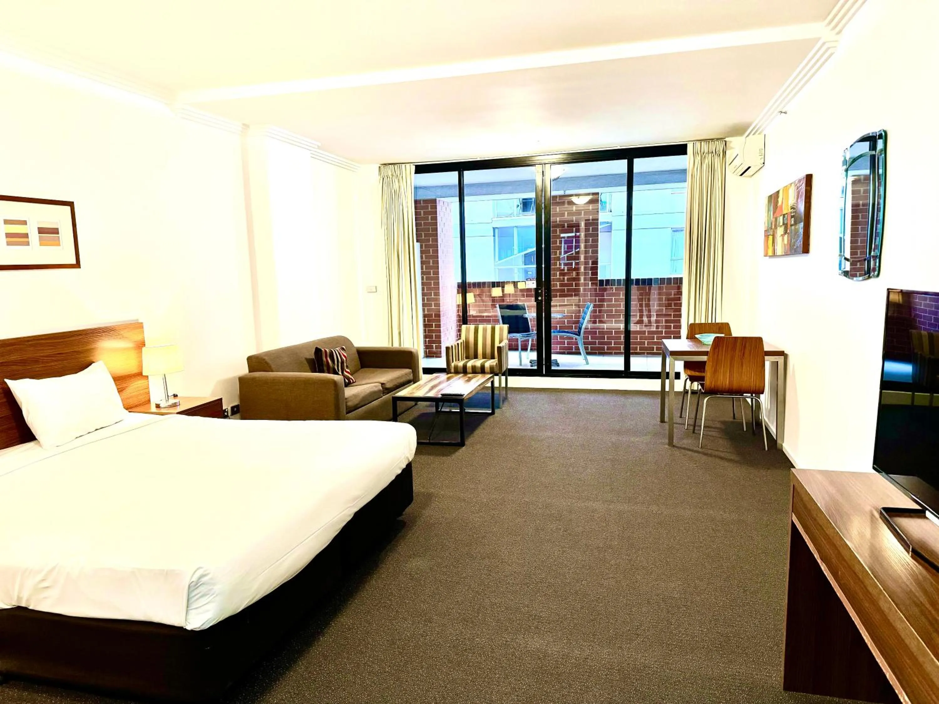 Living room, Bed in APX Darling Harbour