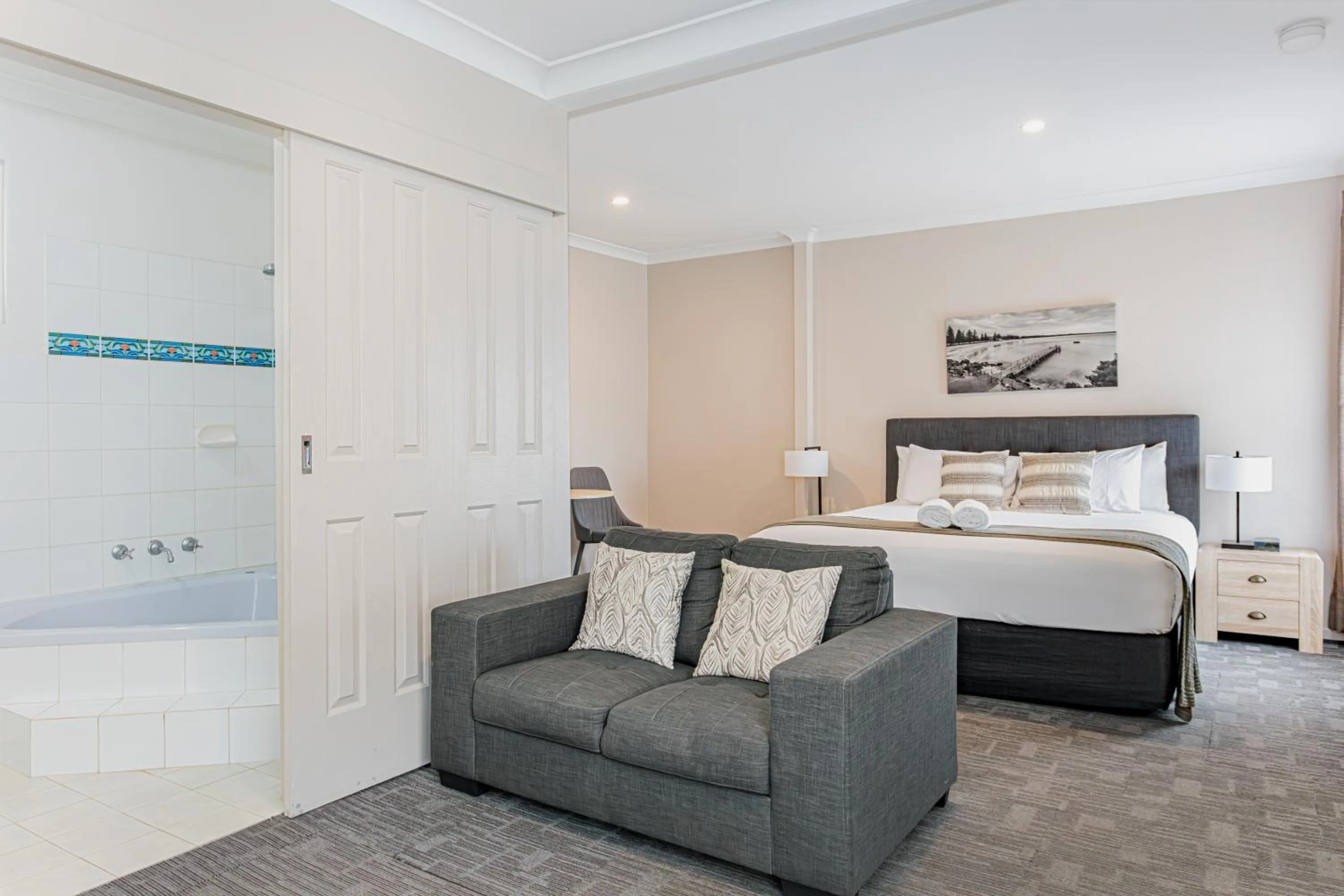 Shower, Bed in Mandala Ace Albany Hotel