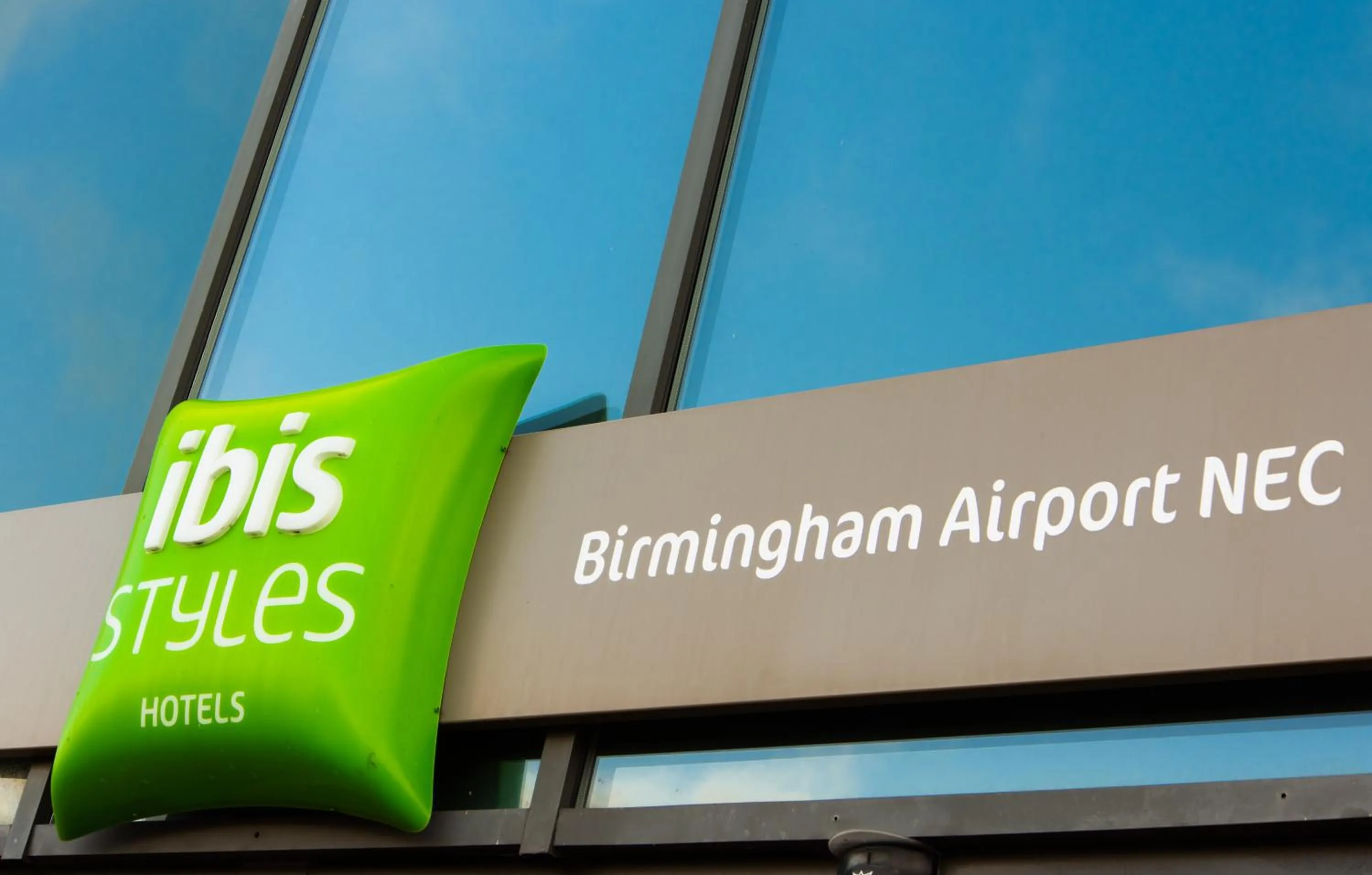 Property logo or sign in ibis Styles Birmingham NEC & Airport