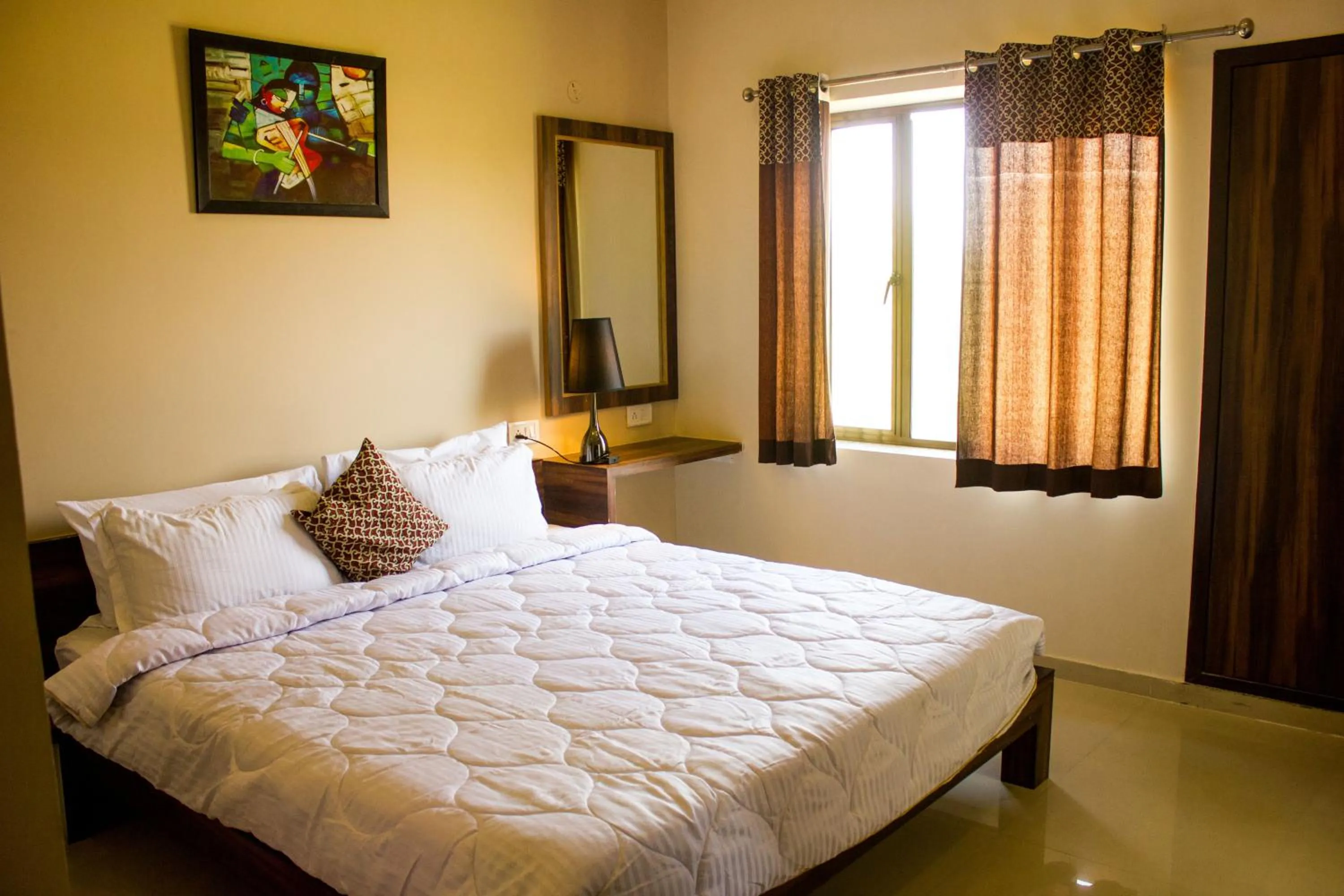 Bedroom in Riverarch Greenfields Resort