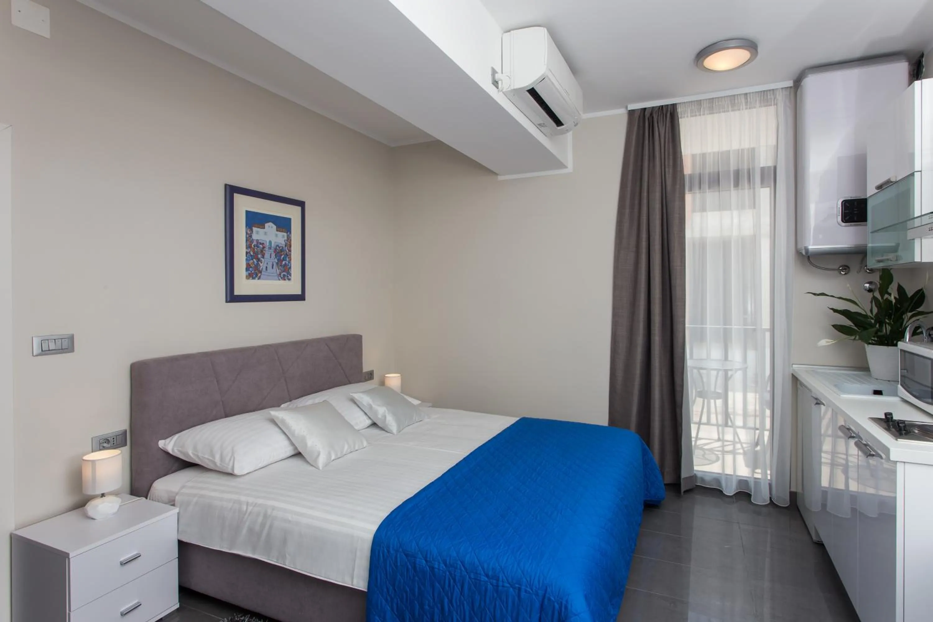 Kitchen or kitchenette, Bed in Apartments ZoomZoom