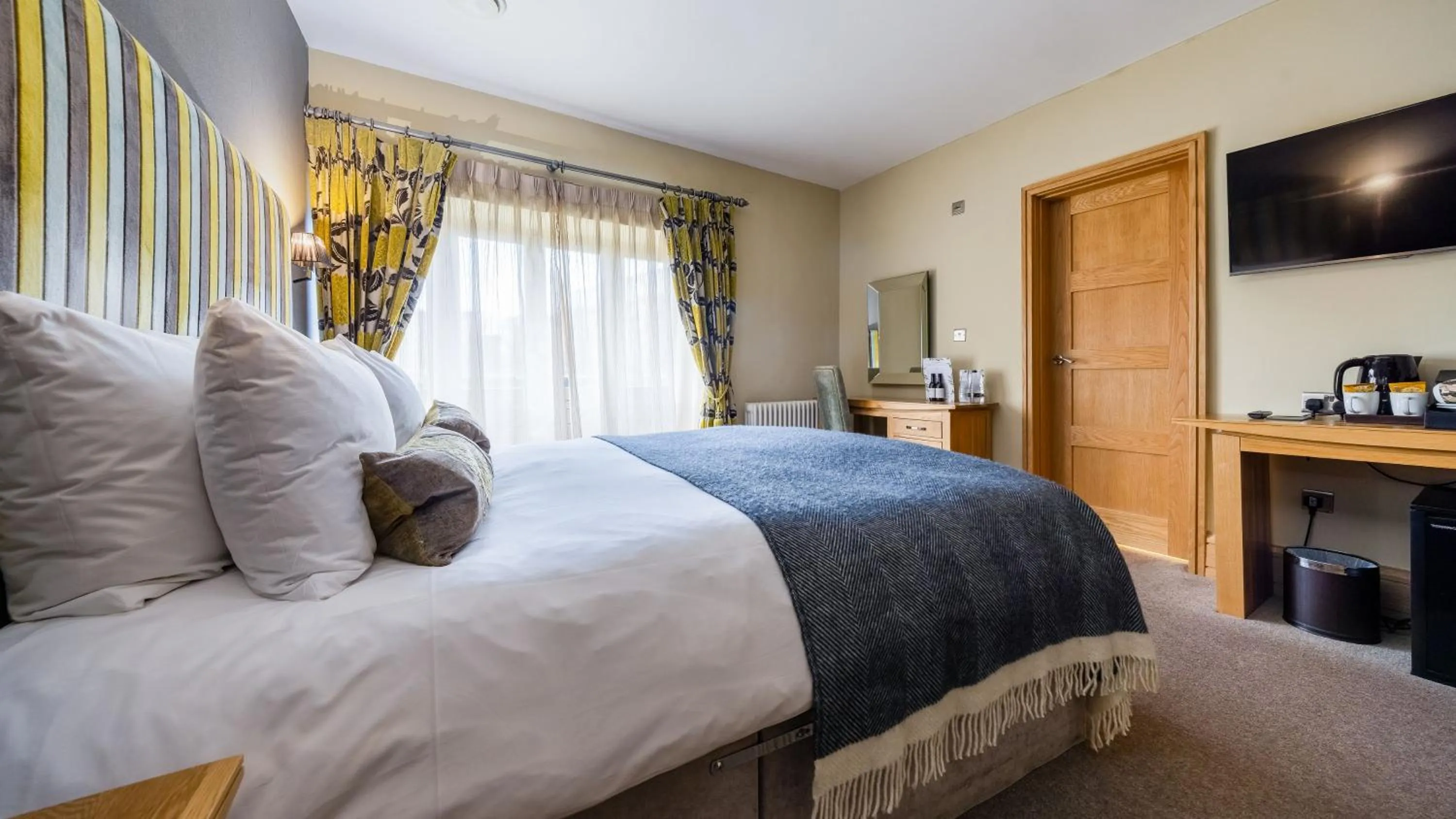 Bed in Ennios Boutique Hotel