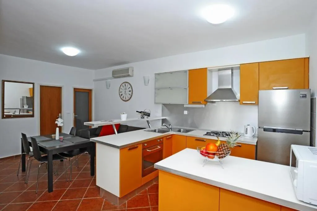 Kitchen or kitchenette in Holiday Home Odiseja