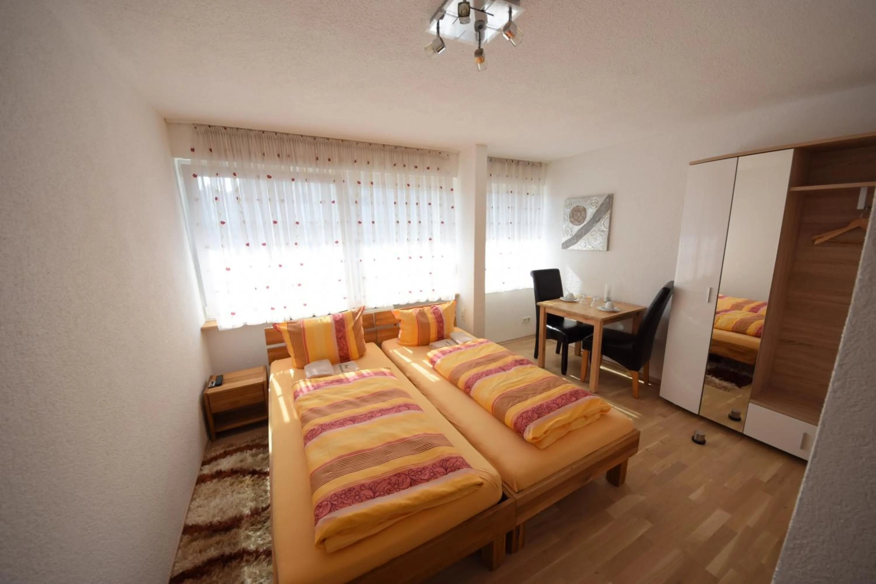 Photo of the whole room, Bed in Gästehaus Neckarsulm