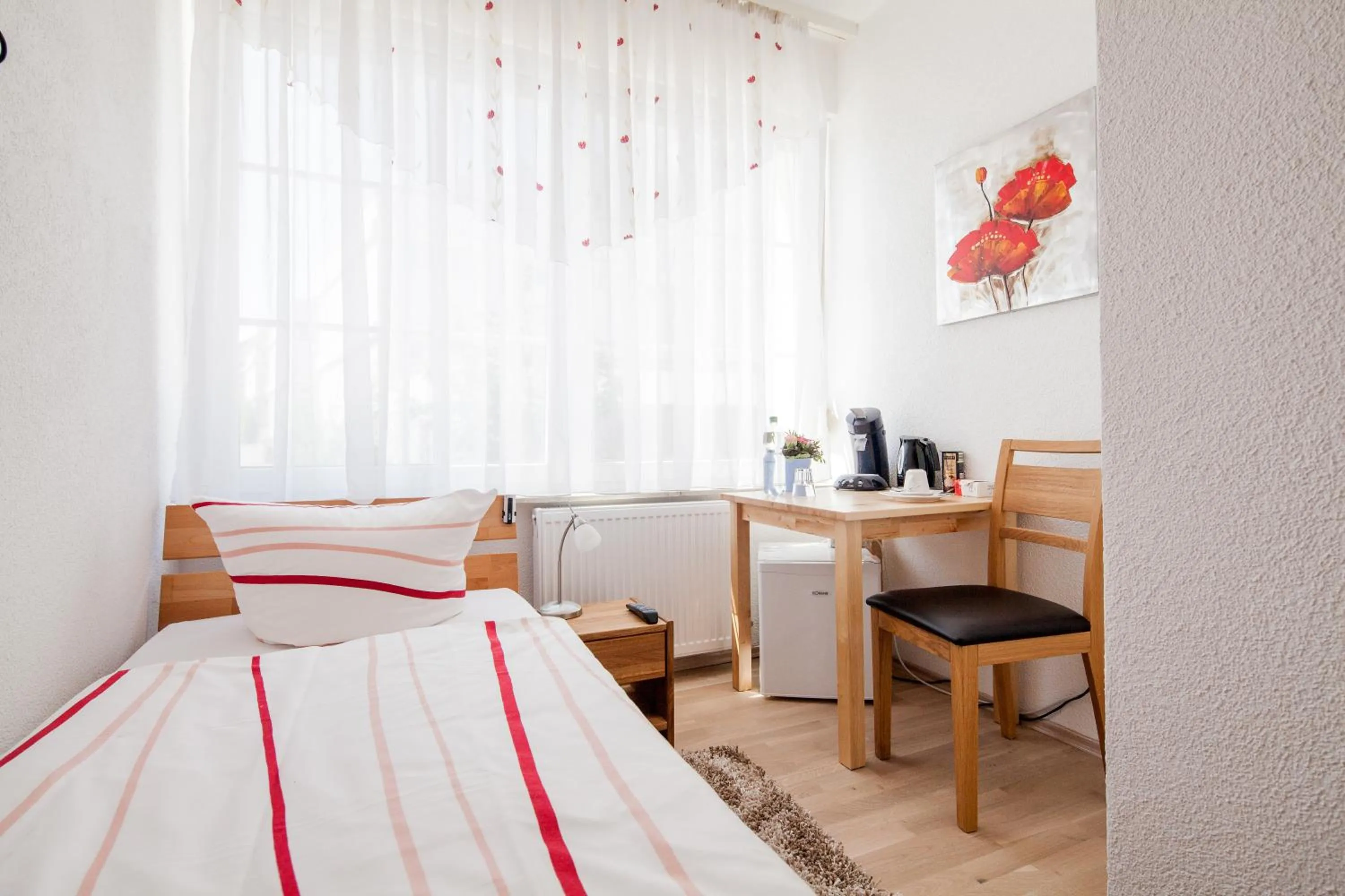 Photo of the whole room, Bed in Gästehaus Neckarsulm