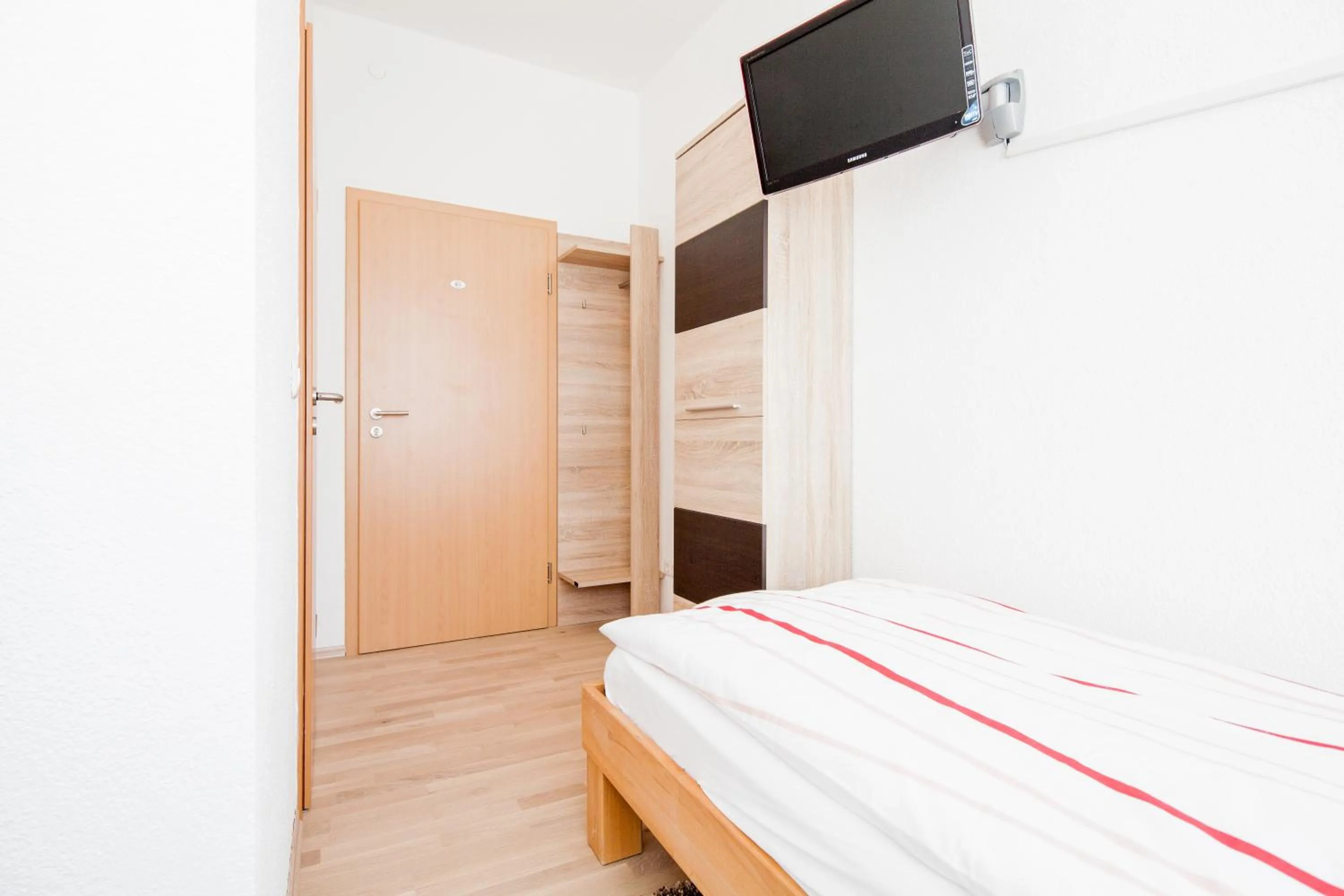 Photo of the whole room, Bed in Gästehaus Neckarsulm