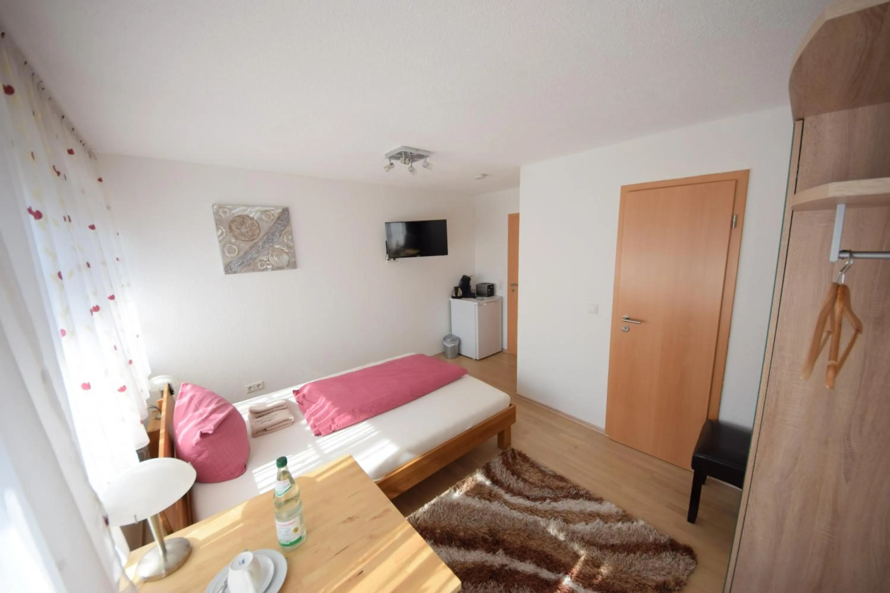 Photo of the whole room, Bed in Gästehaus Neckarsulm