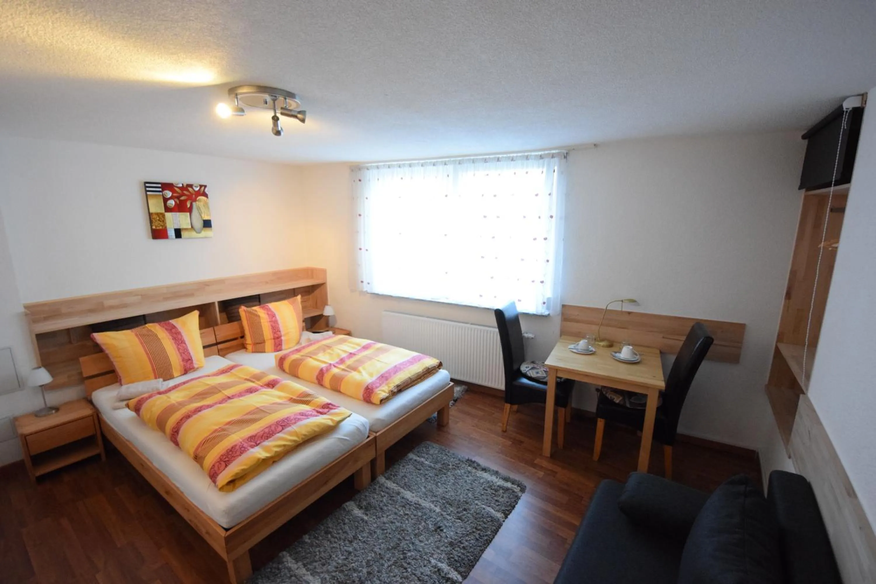 Photo of the whole room, Bed in Gästehaus Neckarsulm