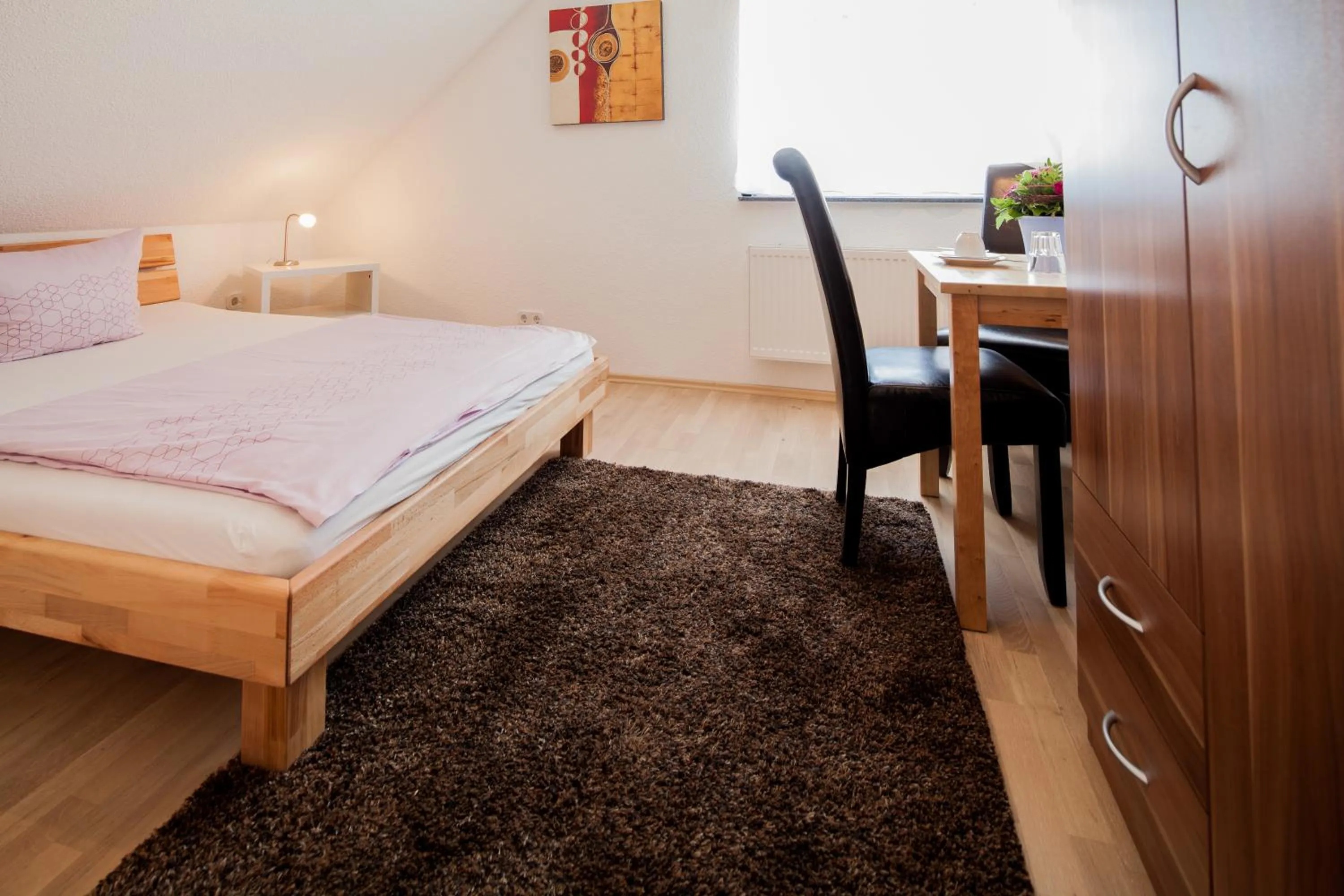 Photo of the whole room, Bed in Gästehaus Neckarsulm