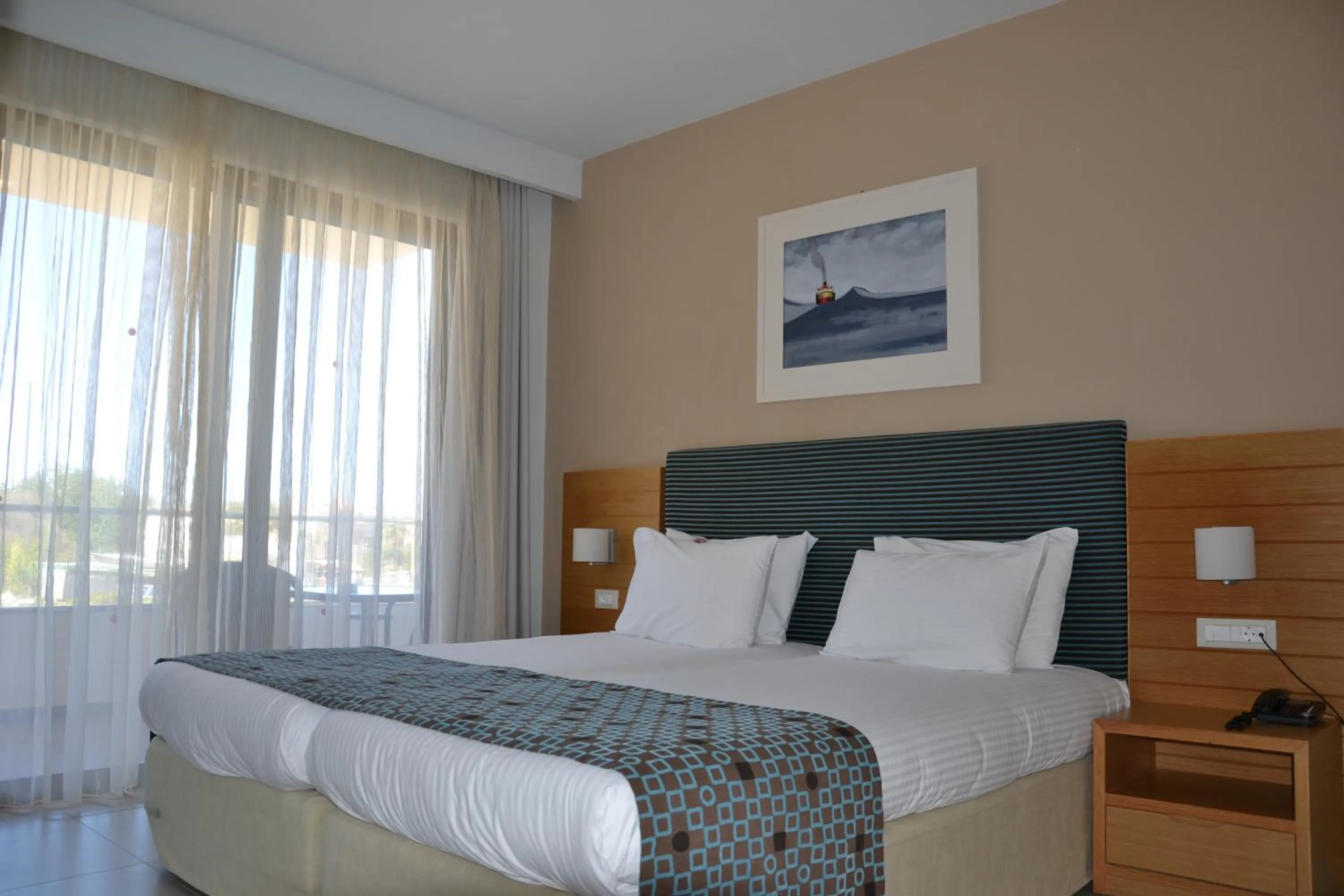Bed in Iolida Beach by Smile Hotels