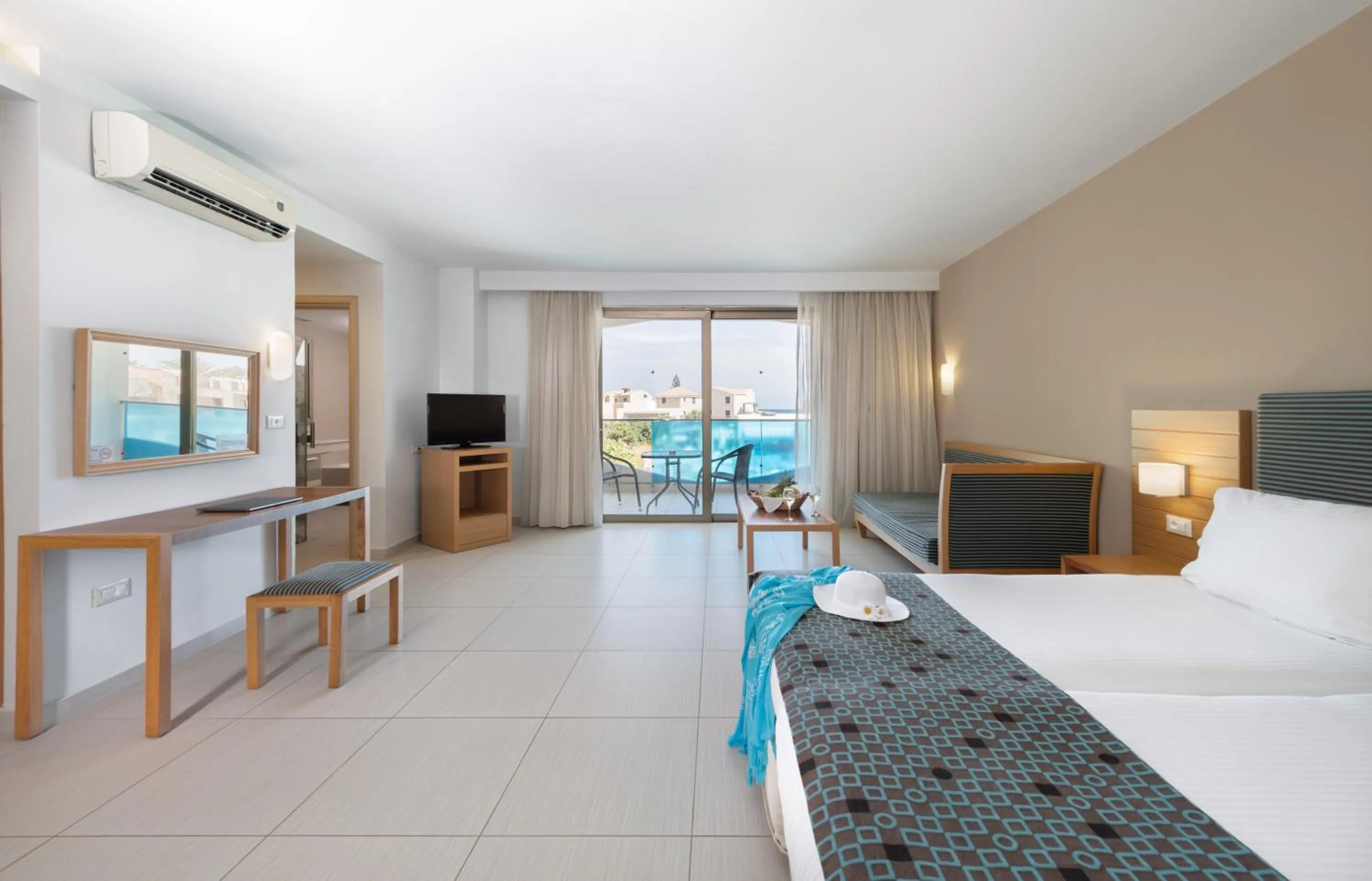 Bed in Iolida Beach by Smile Hotels
