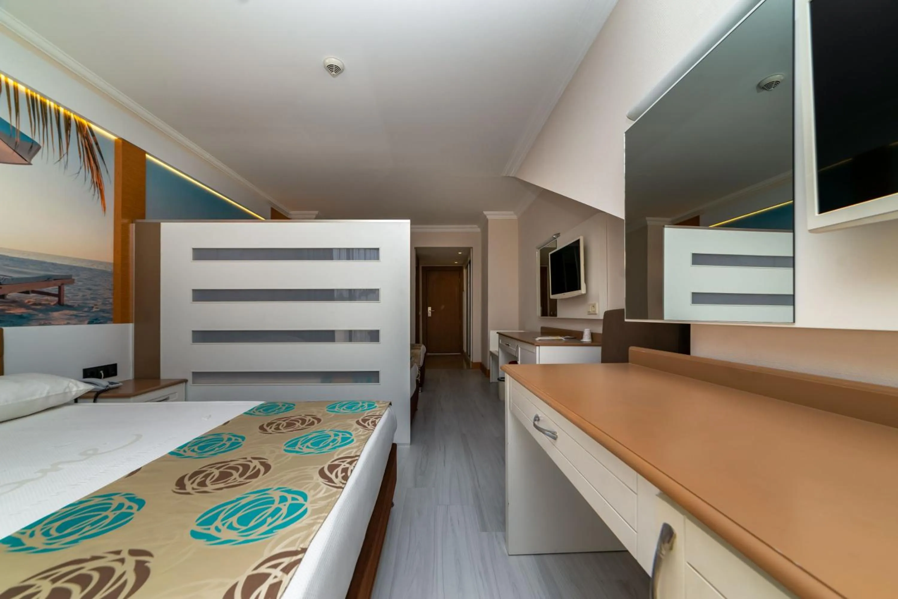 Communal lounge/ TV room, Bed in Primasol Hane Family Resort Hotel