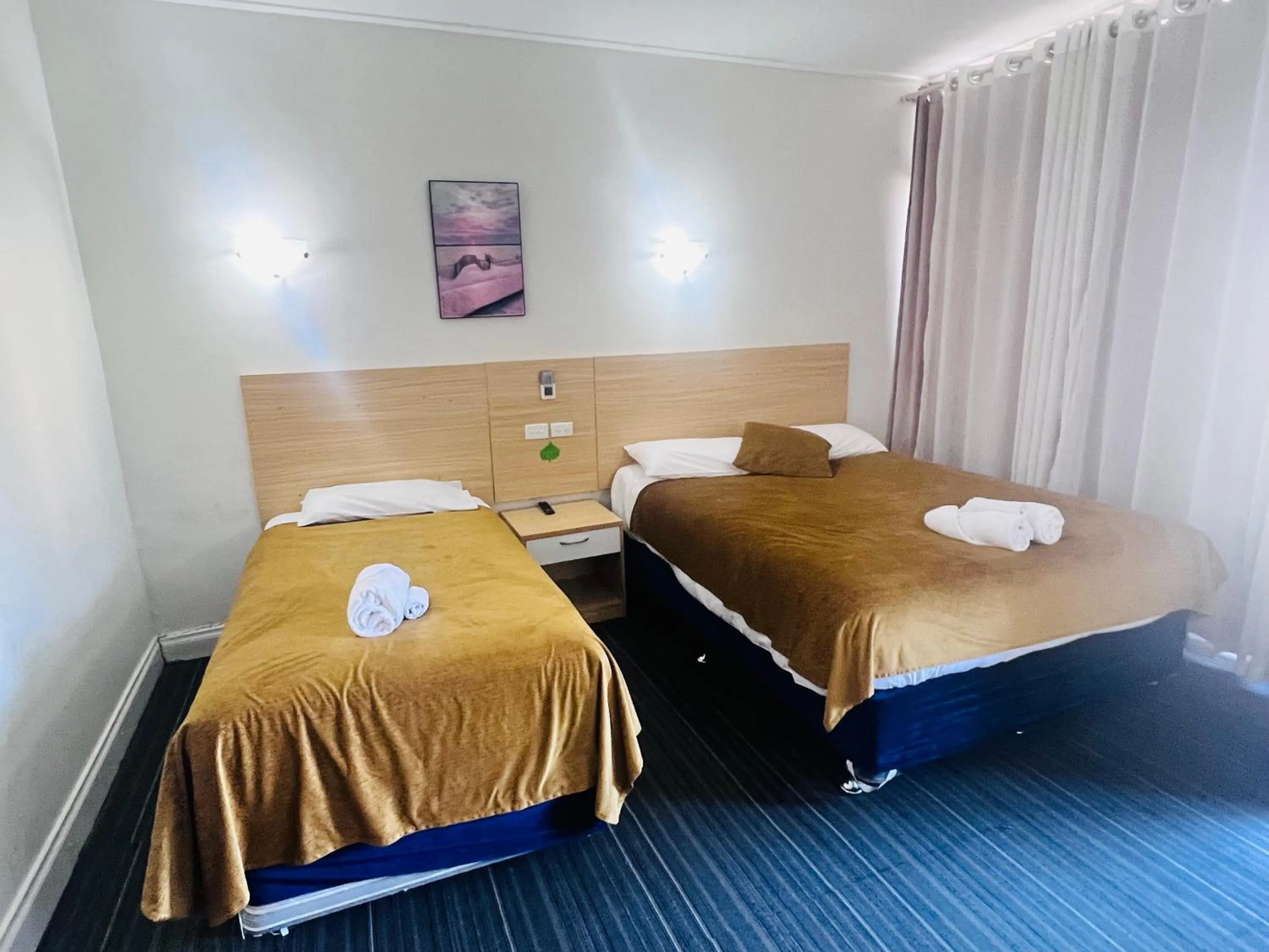 Bed in Jacksons Motor Inn