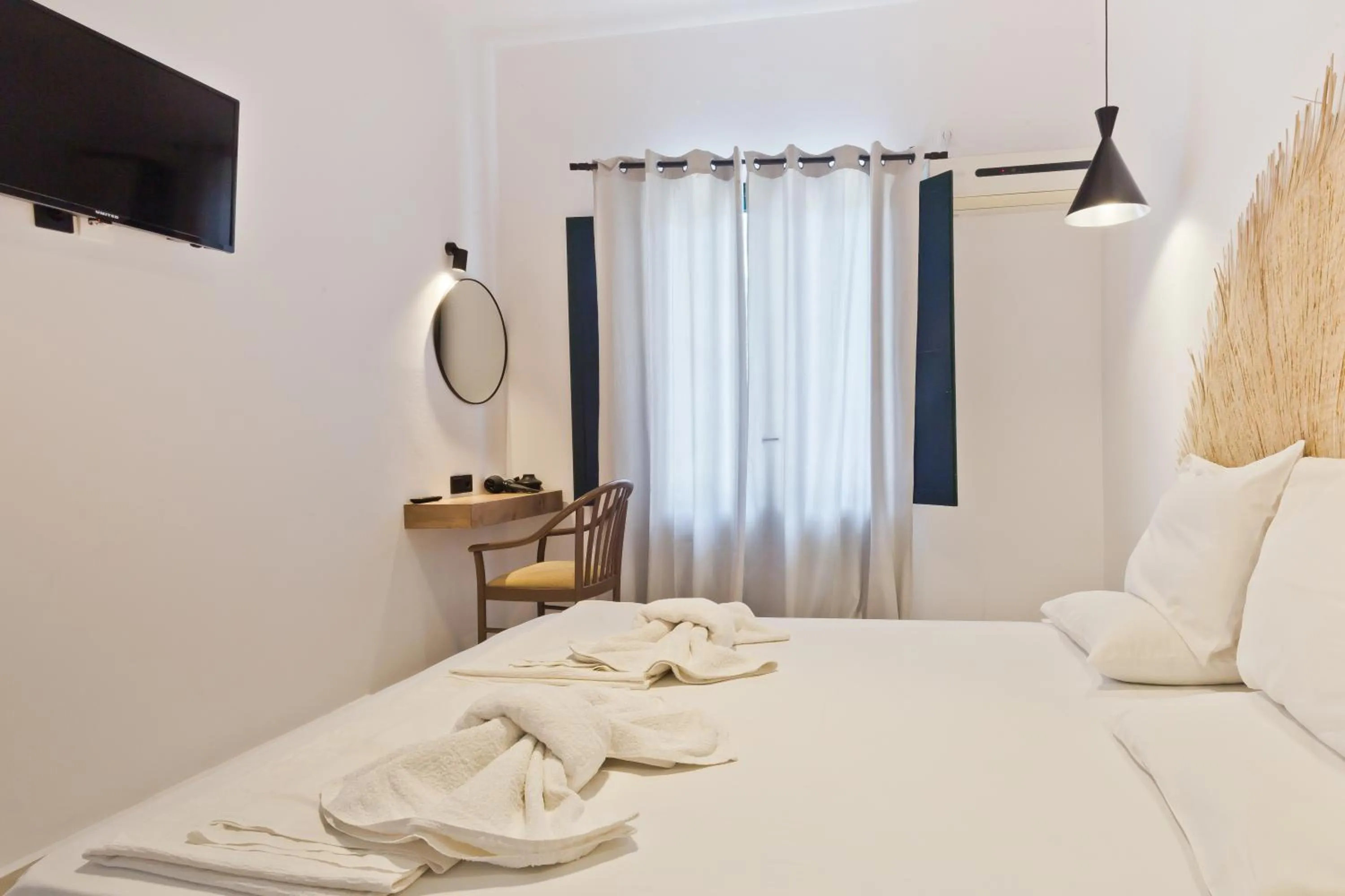 Bed in Kyra Panagia Hotel