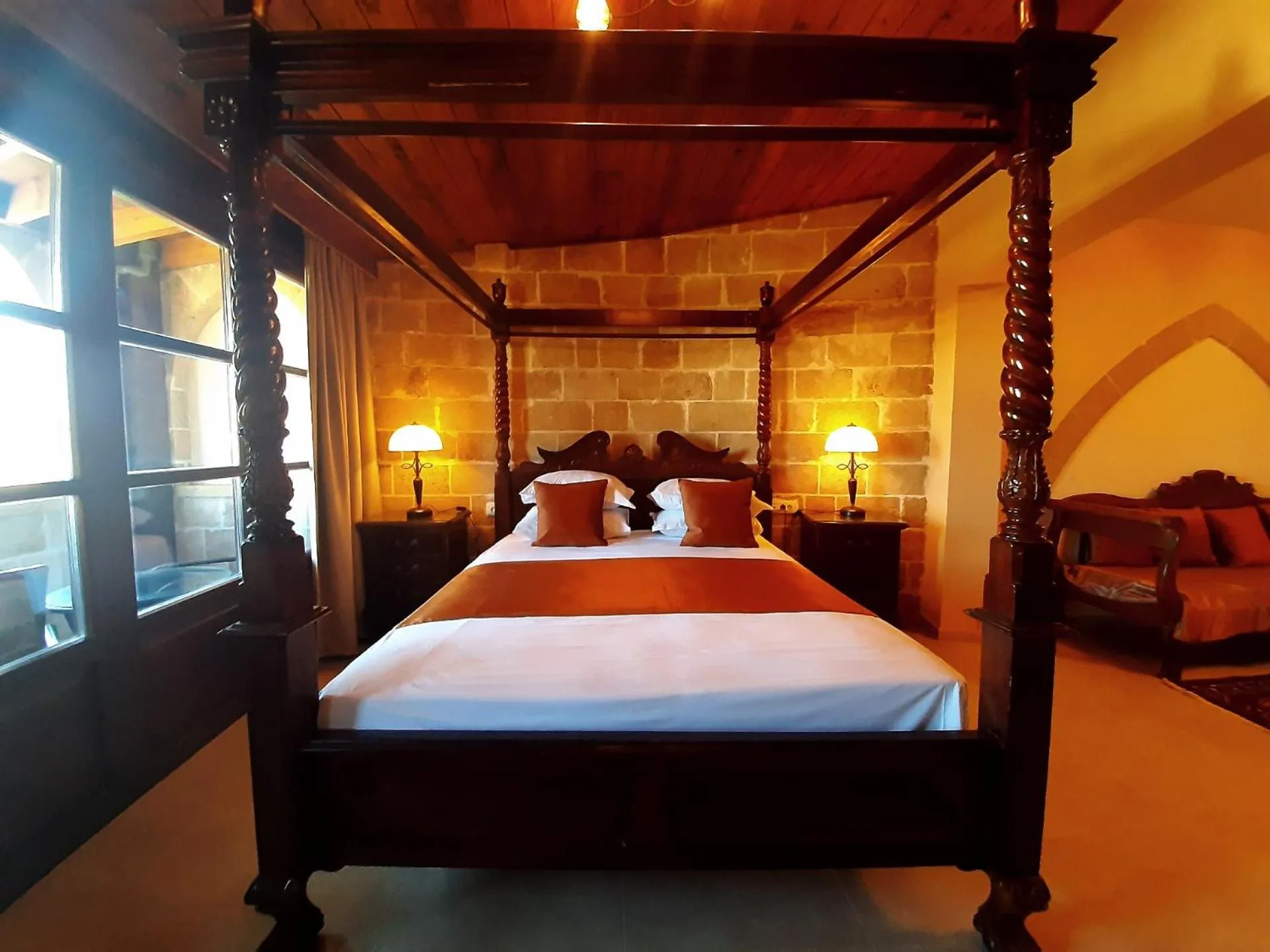 Bed in S.Nikolis' Historic Boutique Hotel