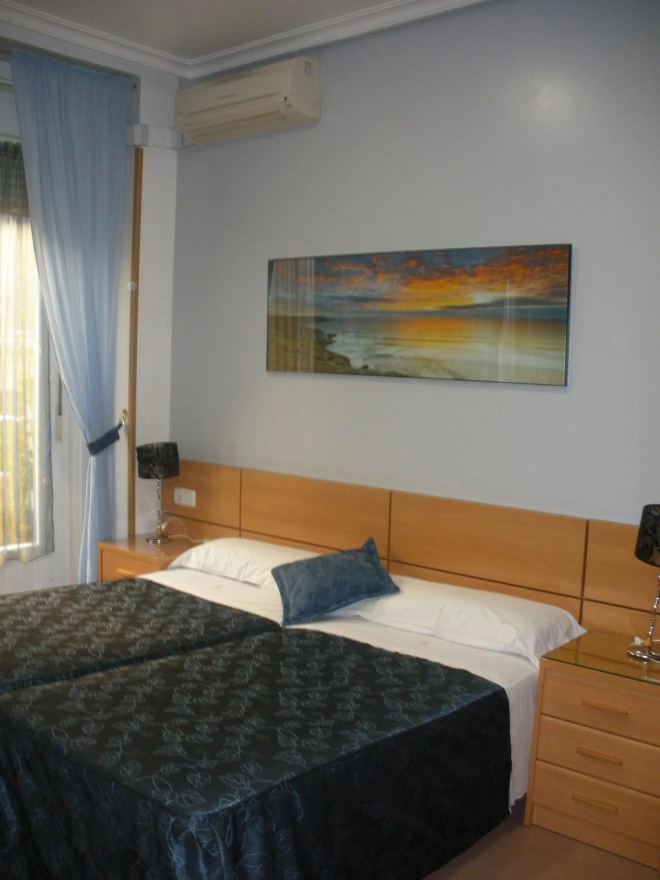 Bed in Hostal del Pez Azul