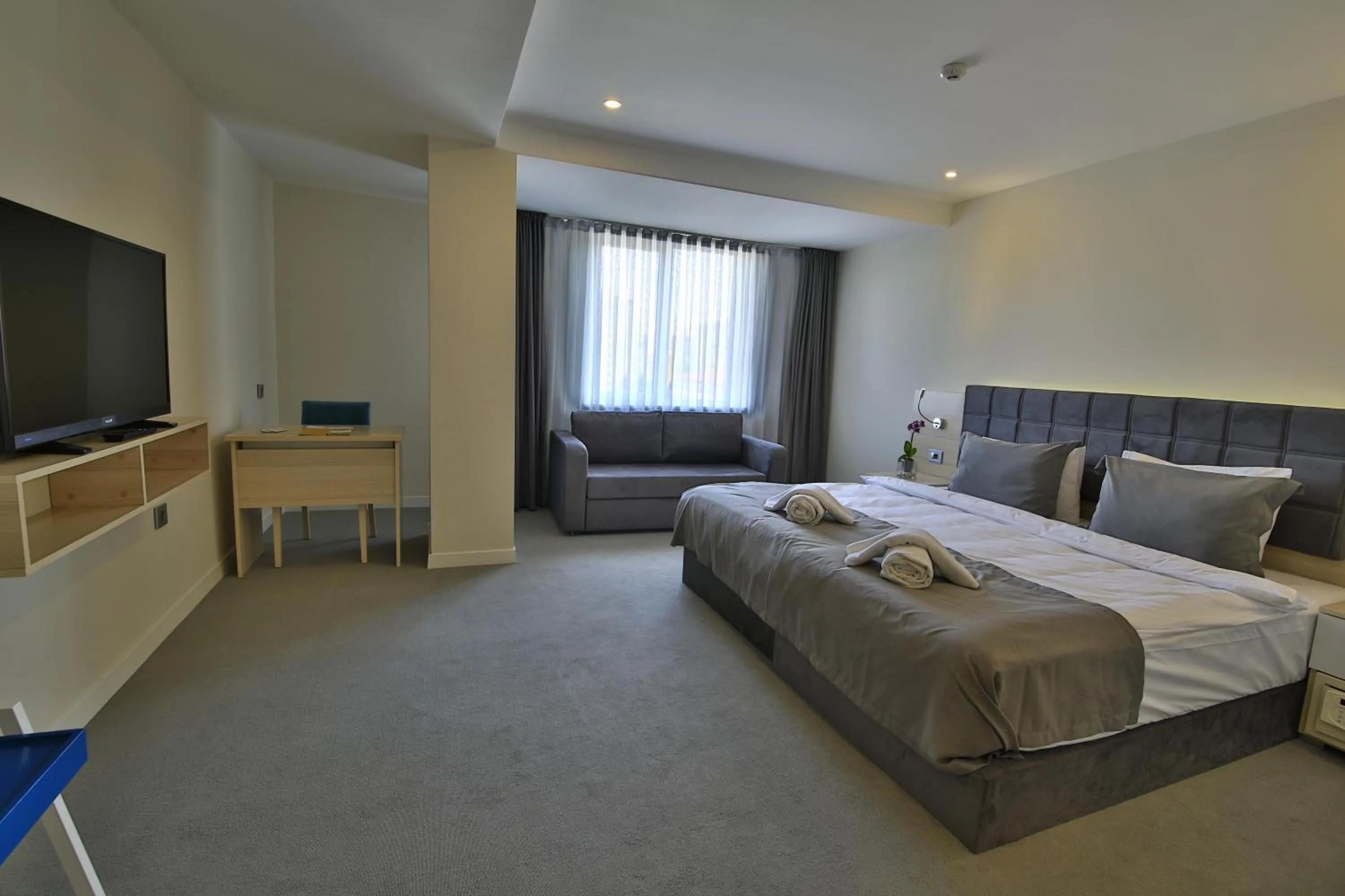 Living room, Bed in leto city hotel