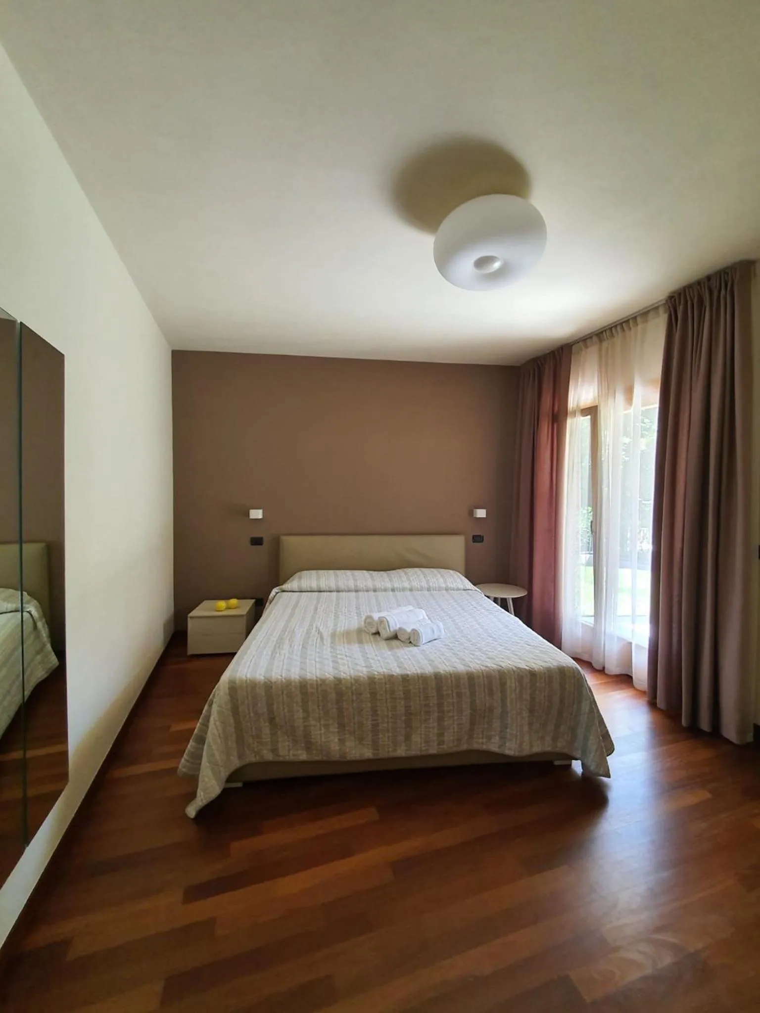 Photo of the whole room, Bed in Sirmione Rosselli Apartments