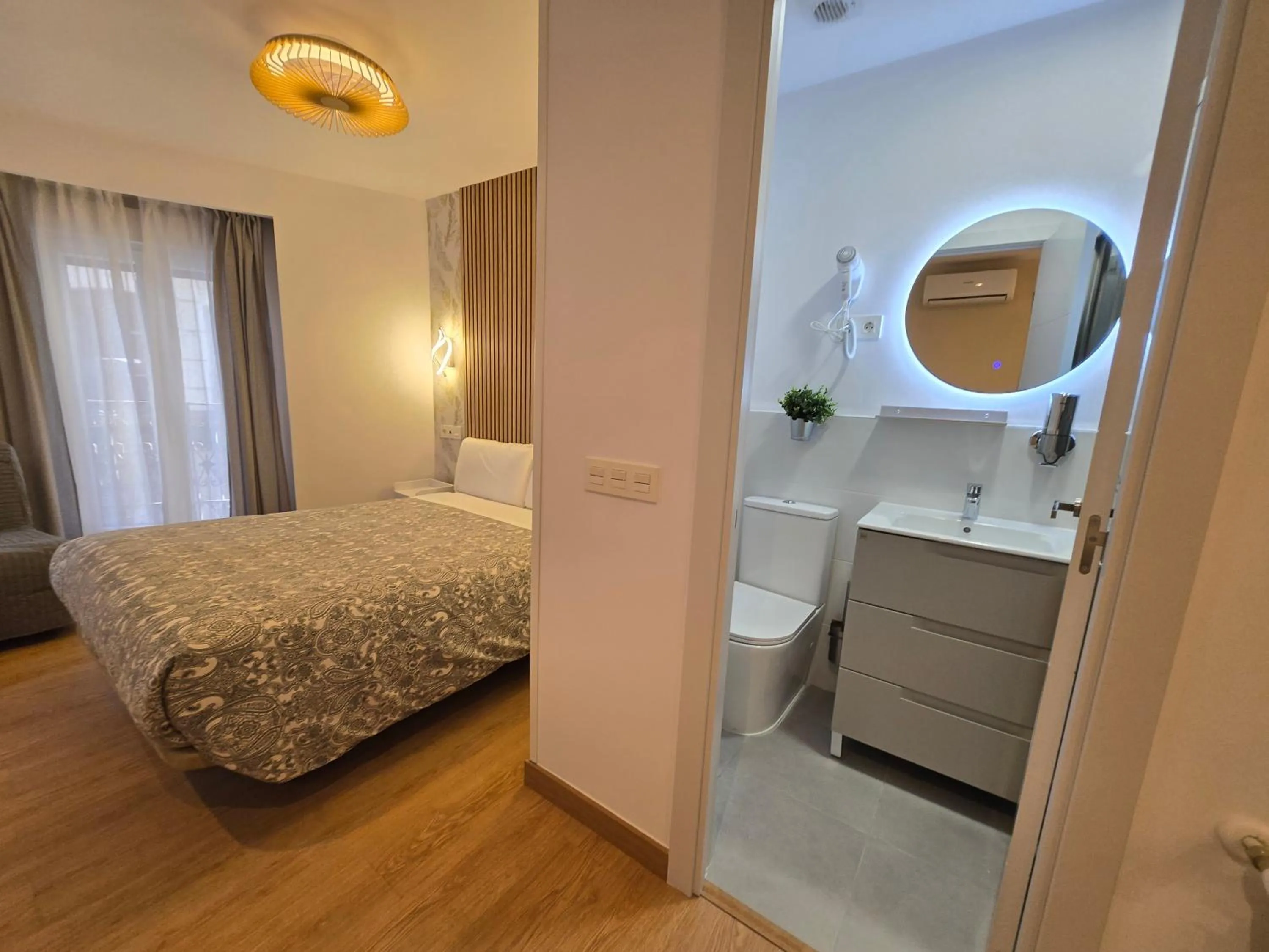 Bathroom, Bed in Hostal A Nuestra Senora de La Paloma