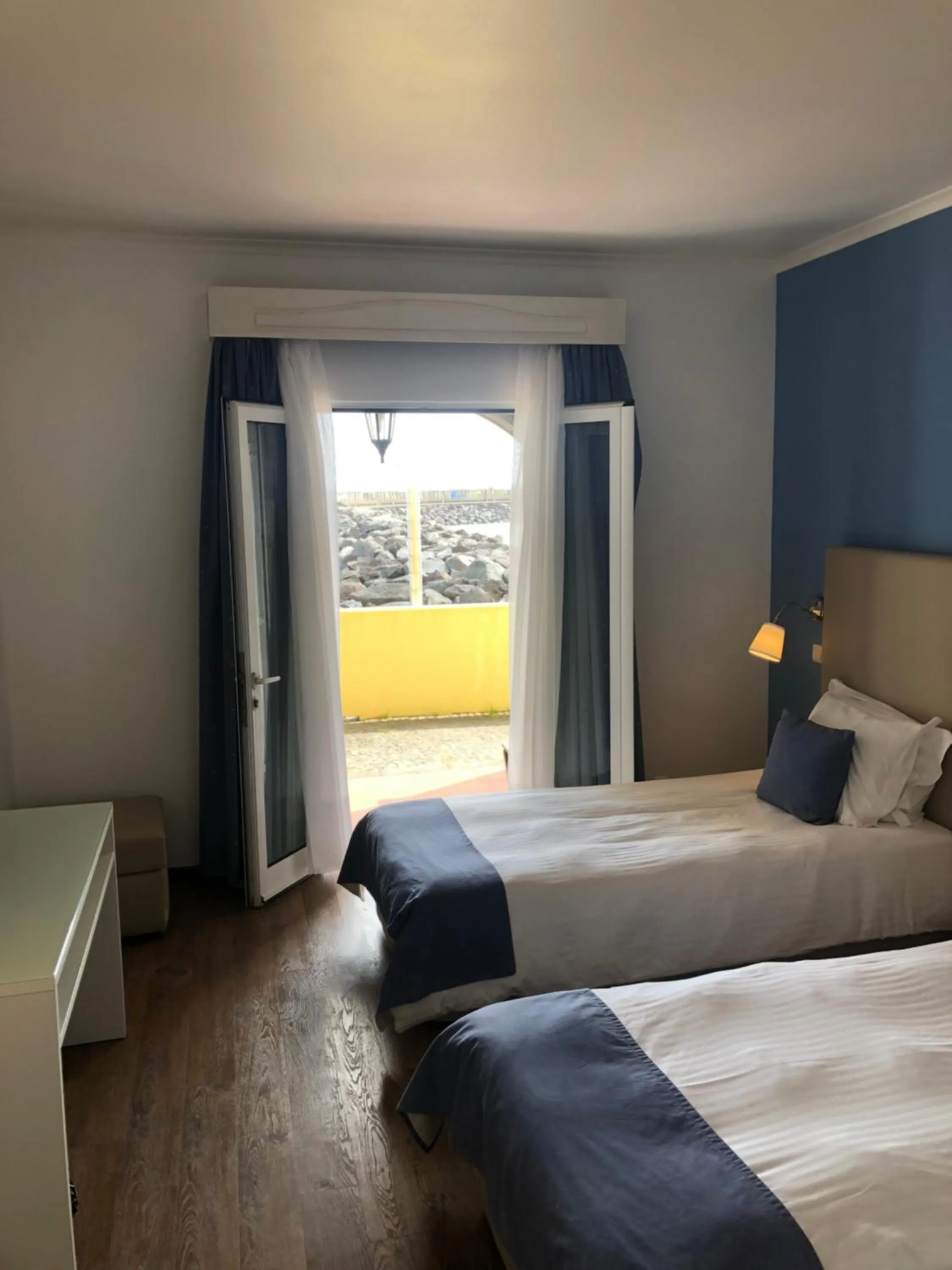 Bed in Vinha da Areia Beach Hotel