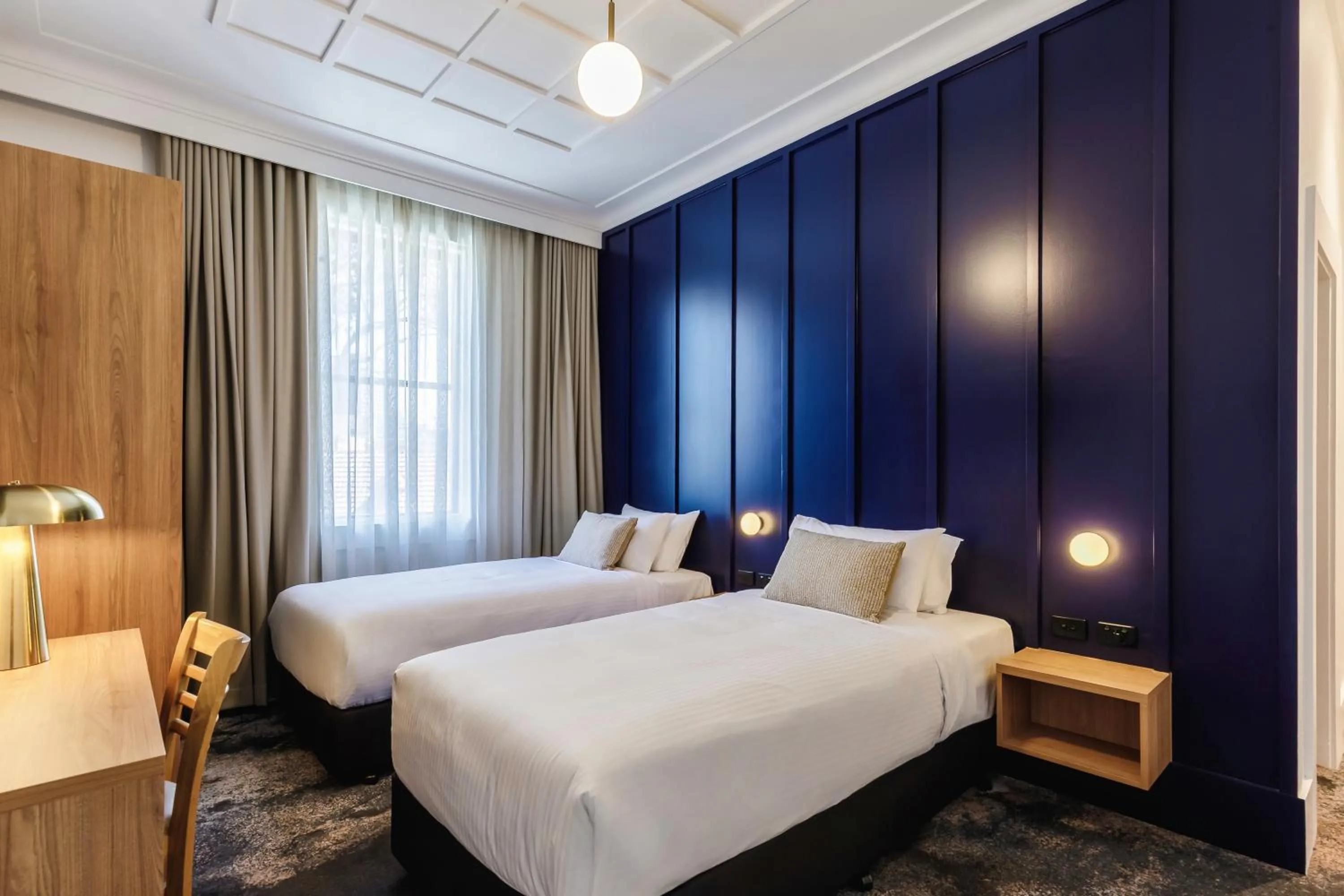 Bed in Royal Exhibition Hotel