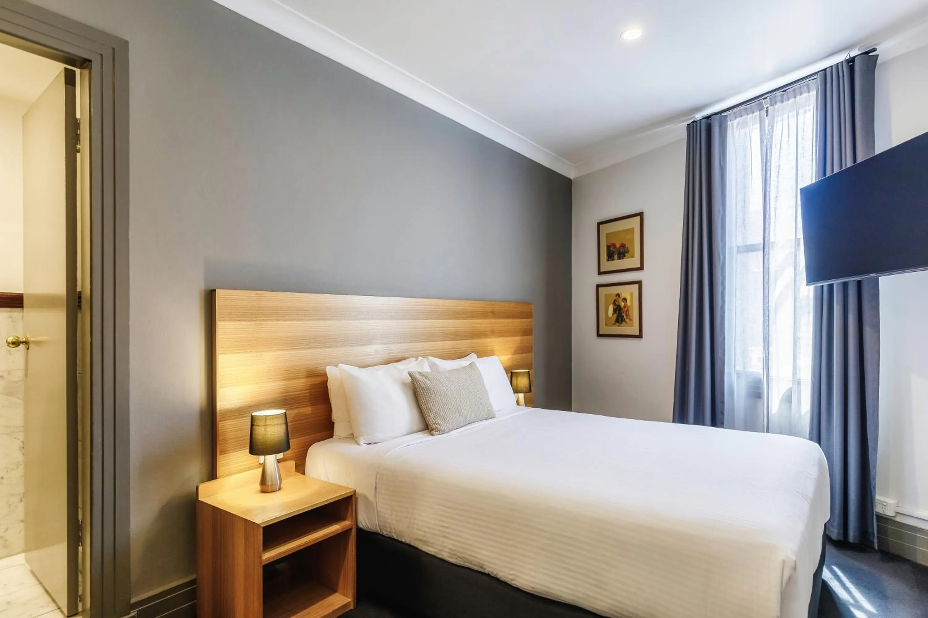 Bed in Royal Exhibition Hotel