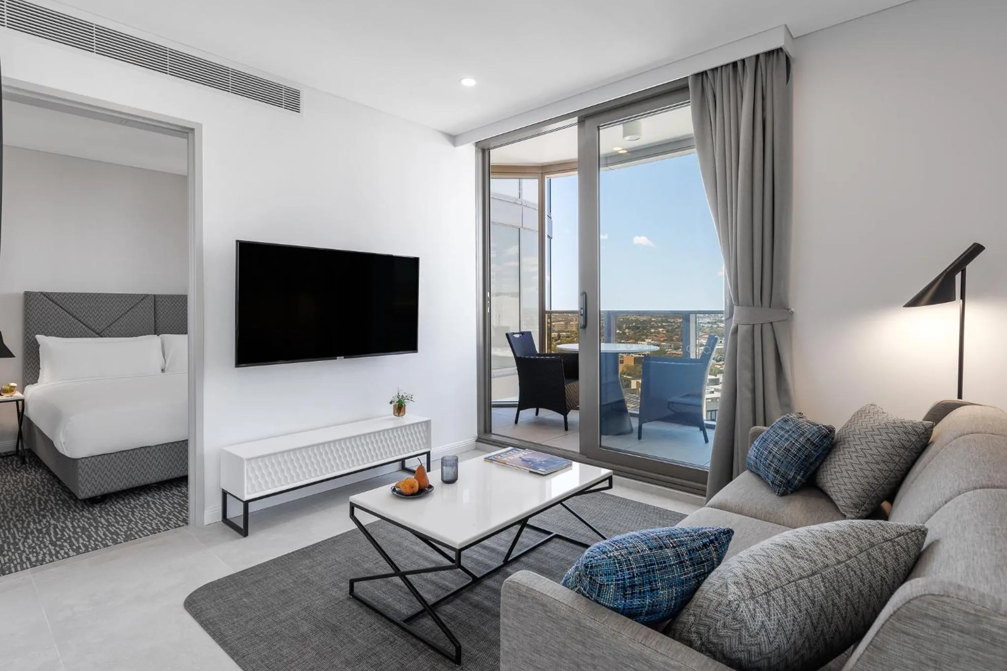 Living room, Bed in Meriton Suites George Street, Parramatta