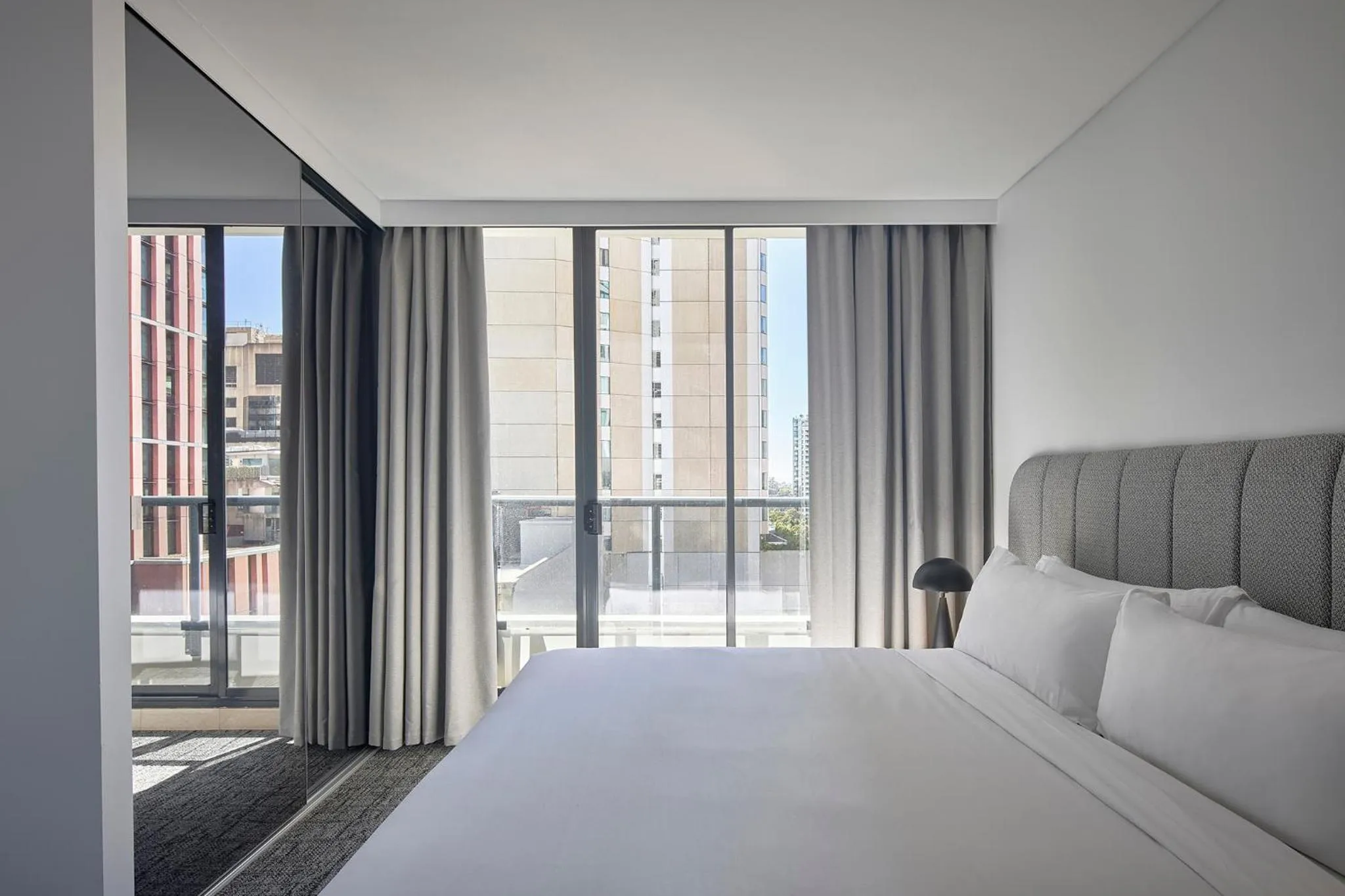 Bed in Meriton Suites Pitt Street, Sydney