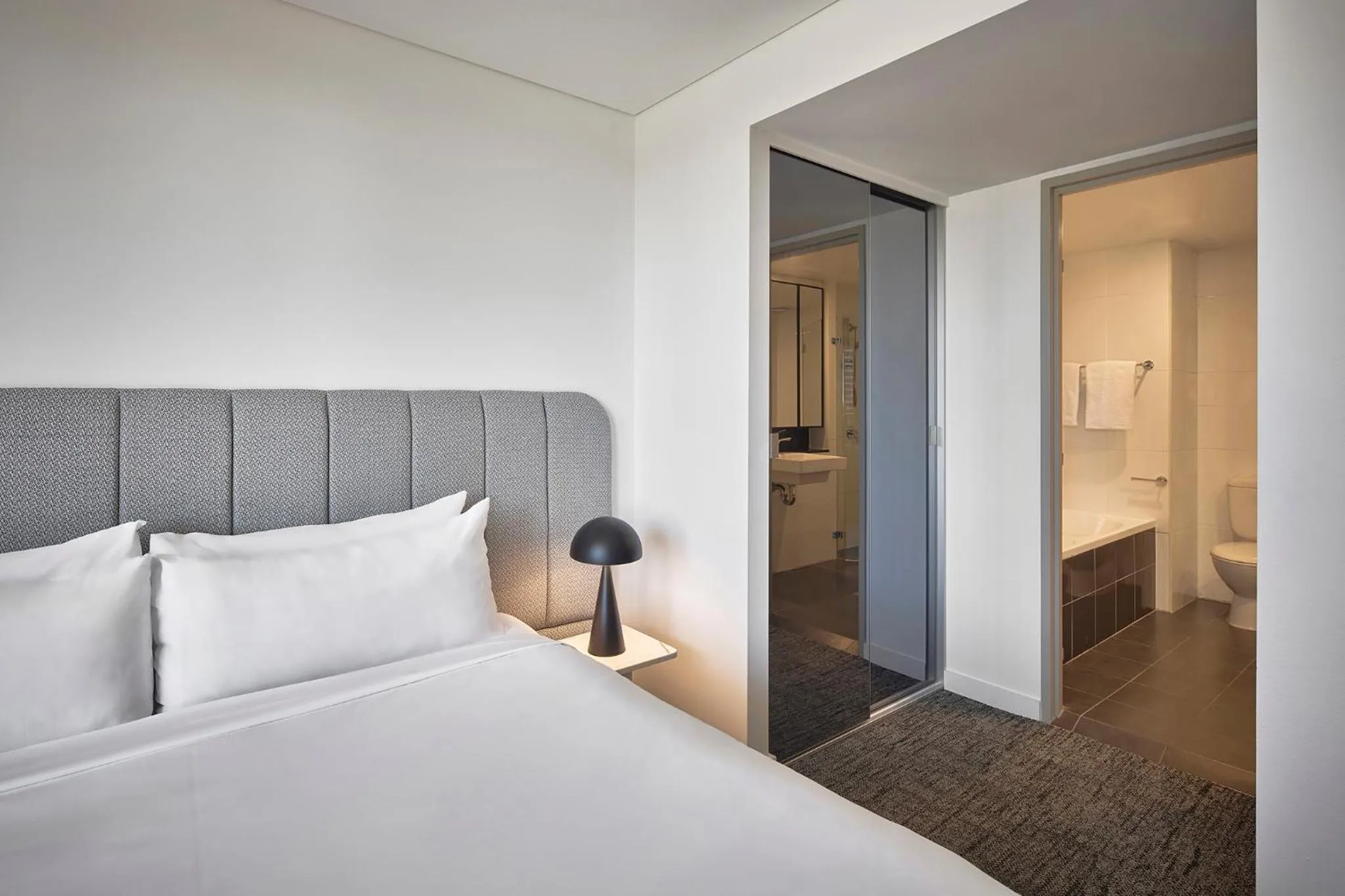 Bed in Meriton Suites Pitt Street, Sydney