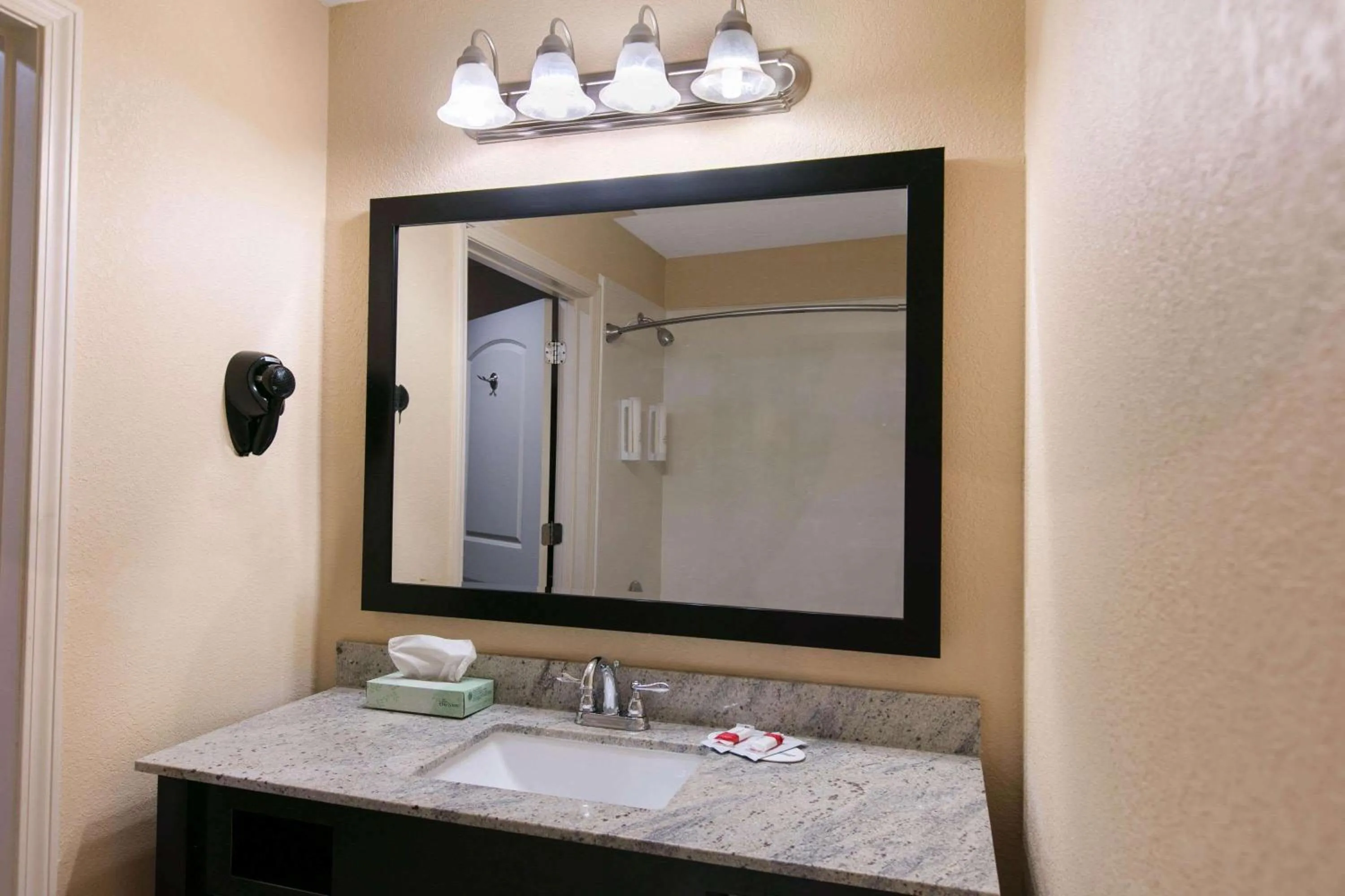 Bathroom in Days Inn & Suites by Wyndham Florence/Jackson Area