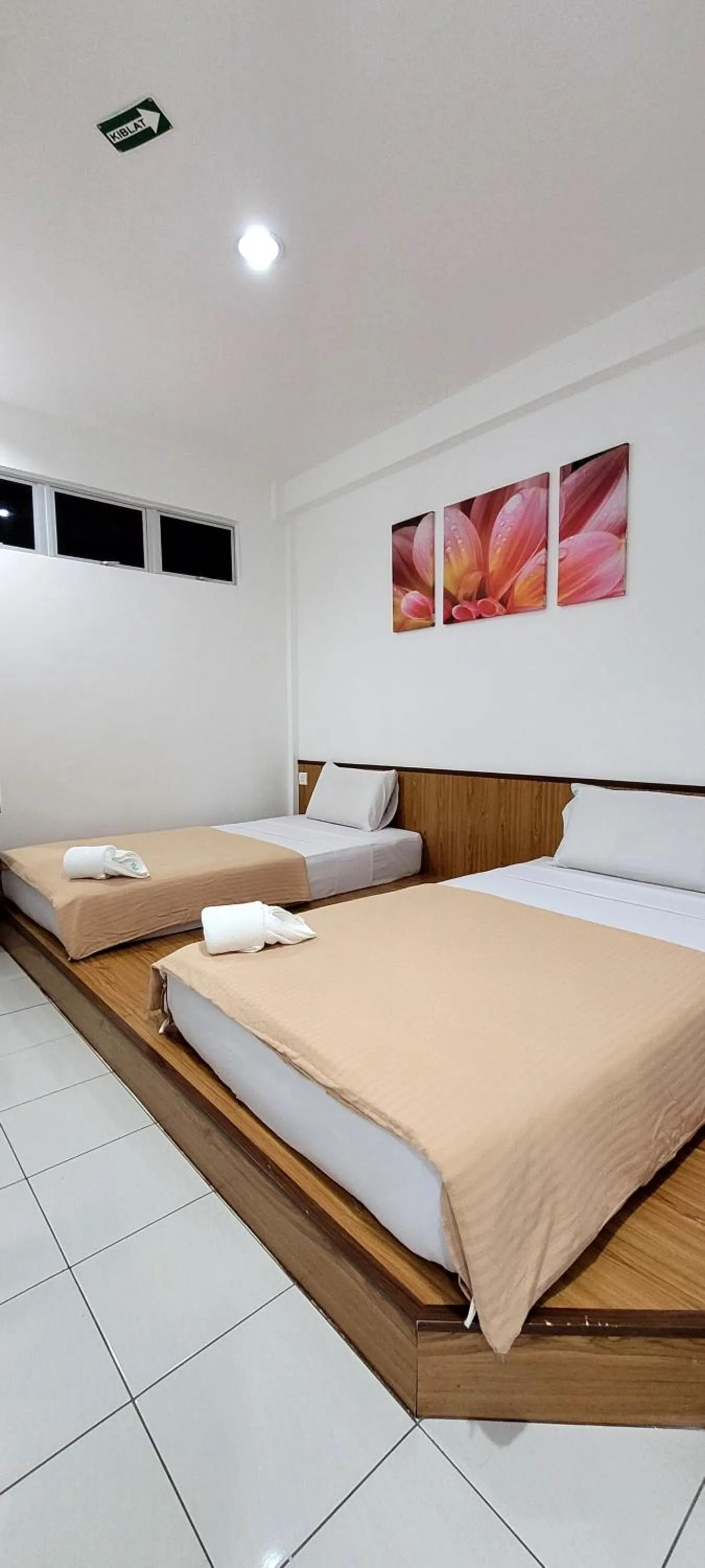 Bed in Api-Api GuestHouse