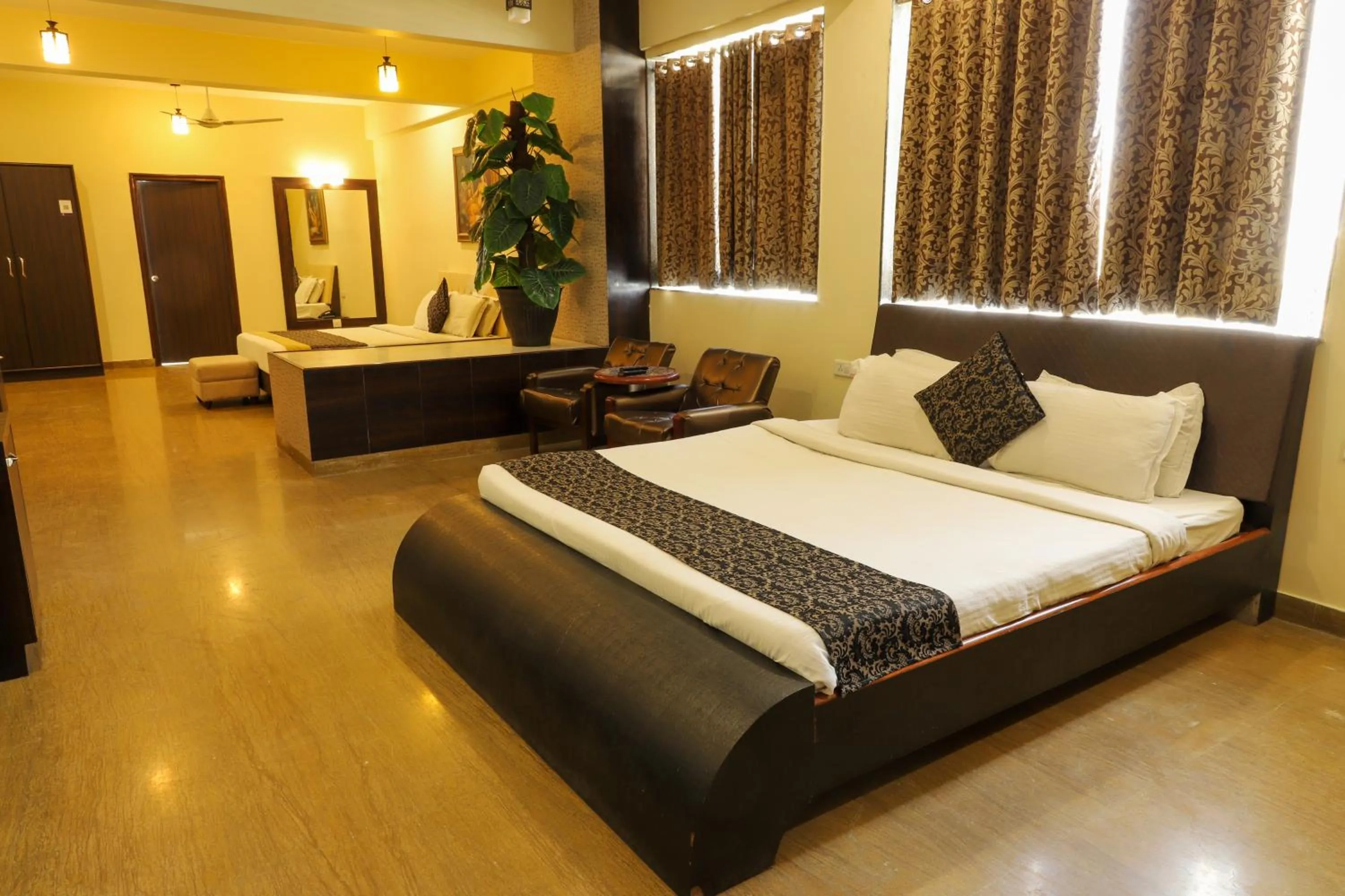 Bedroom, Bed in Regenta Central Mewargarh, Near Biological park