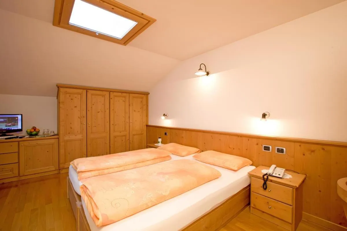 Bed in Hotel Garnì al Plan