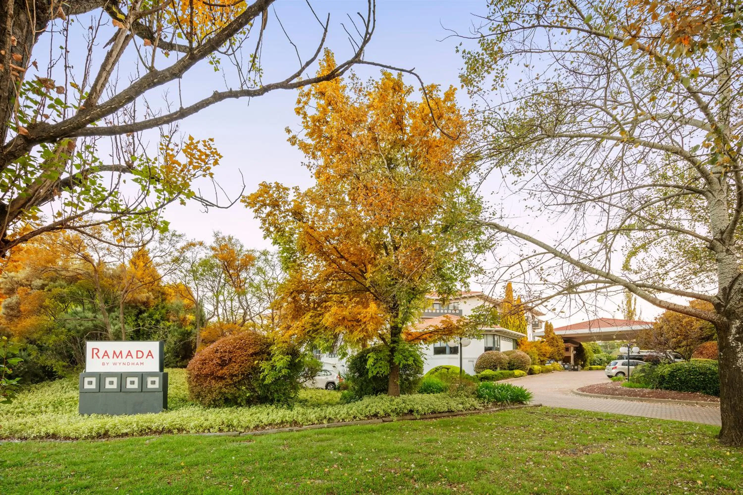 Property logo or sign in Ramada by Wyndham Diplomat Canberra