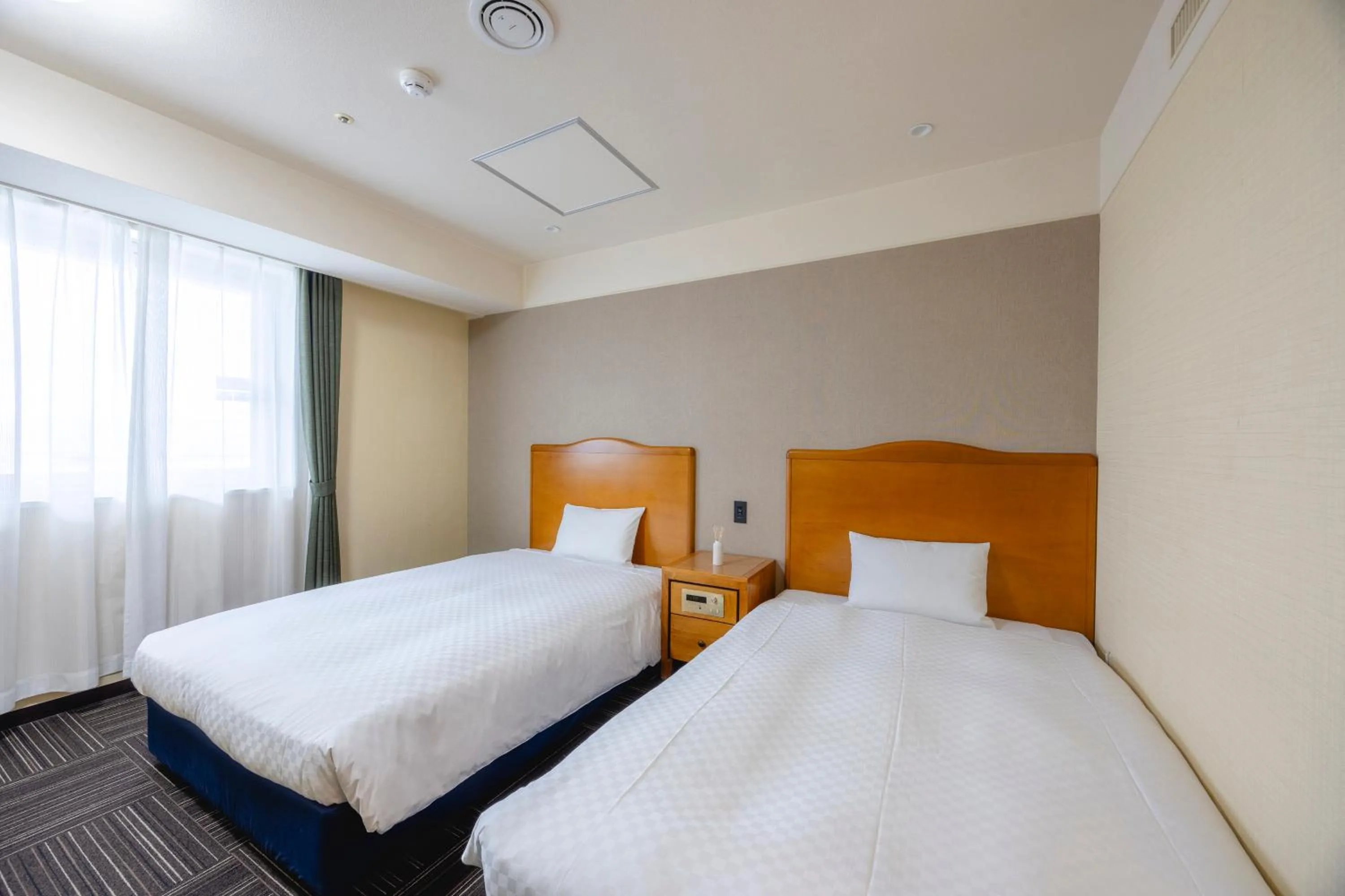 Bed in Kanku Izumiotsu Washington Hotel