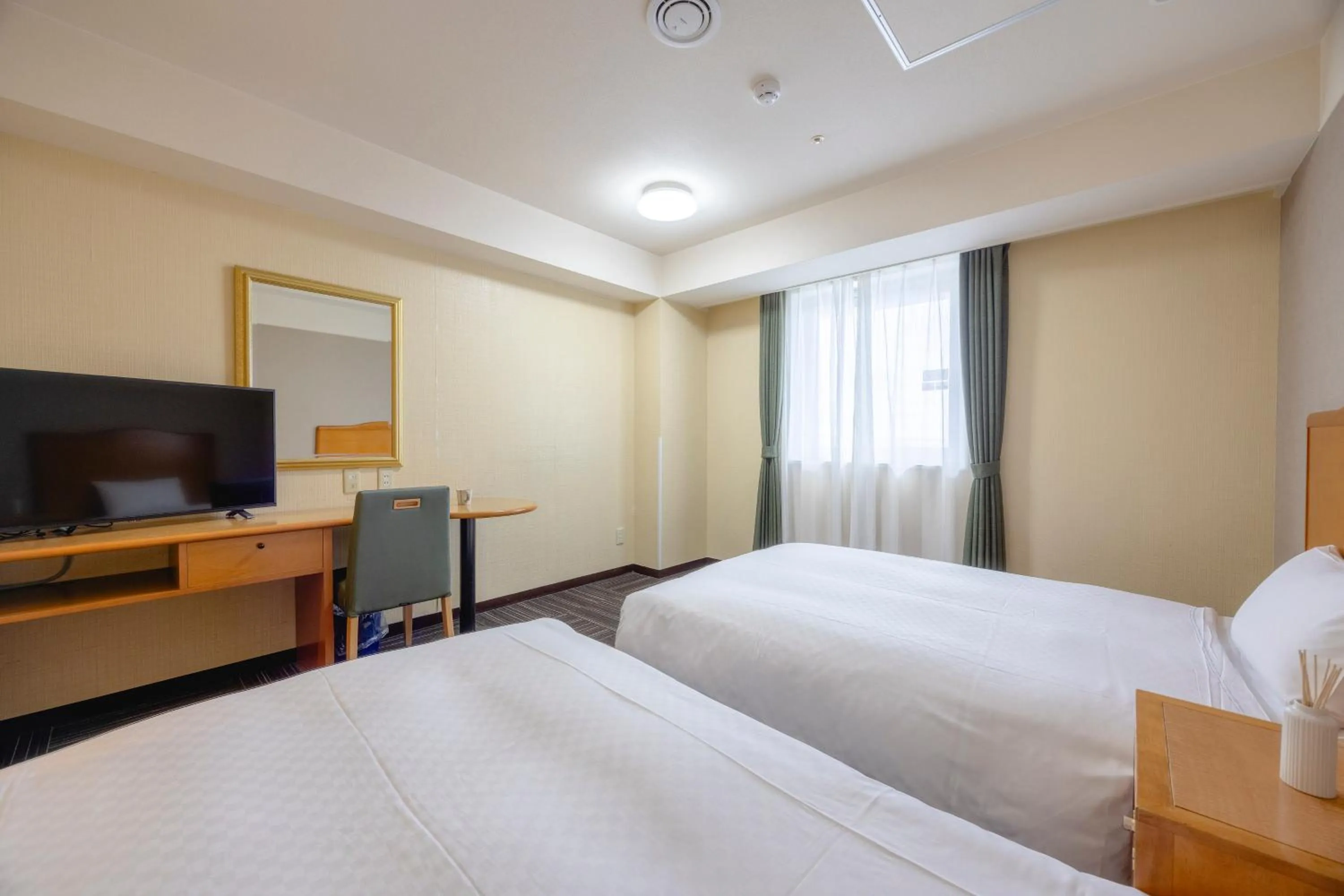 Bed in Kanku Izumiotsu Washington Hotel