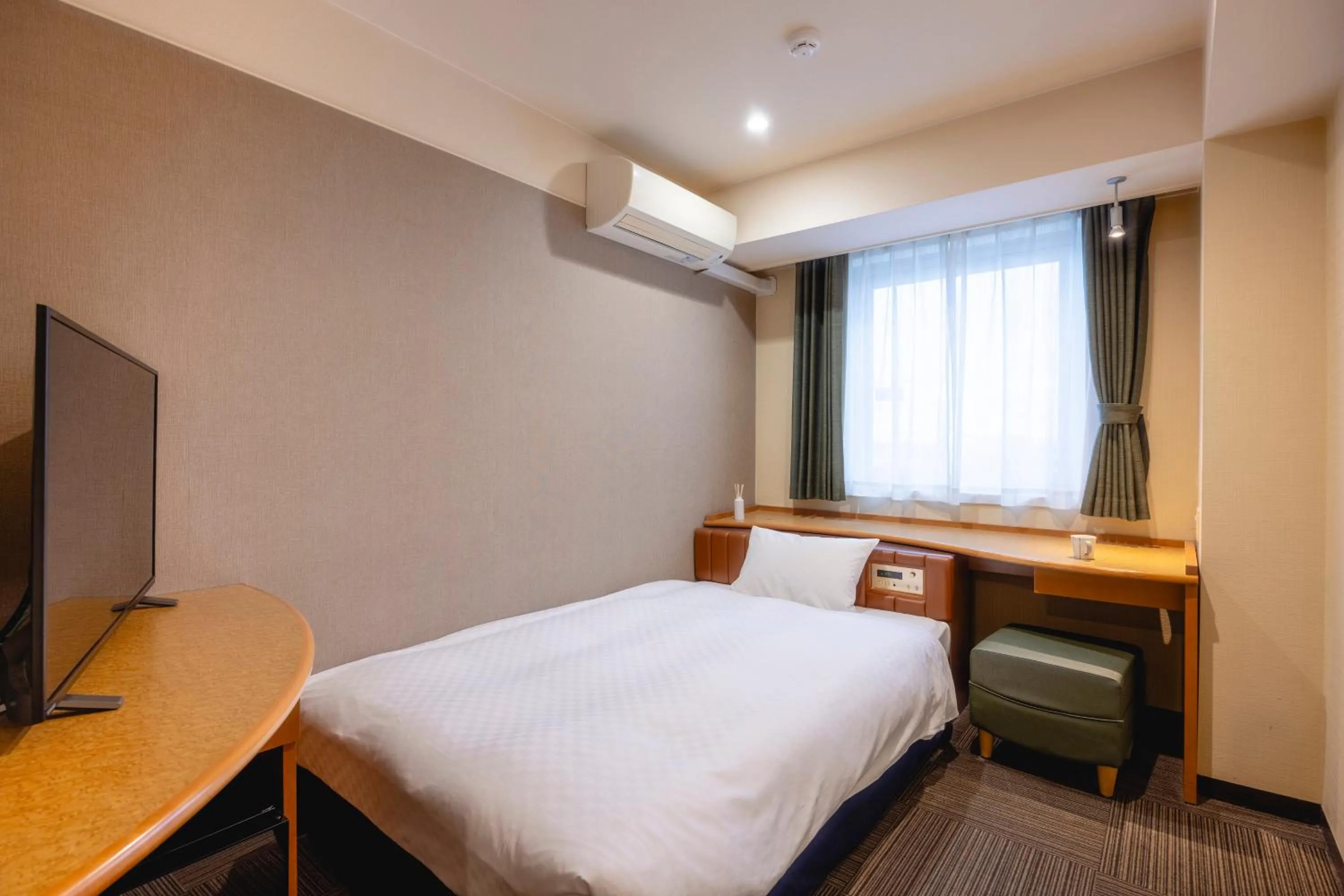 Bed in Kanku Izumiotsu Washington Hotel