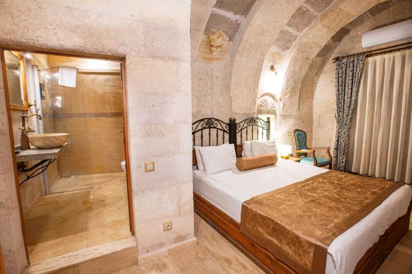 Bed in Caldera Cave Hotel