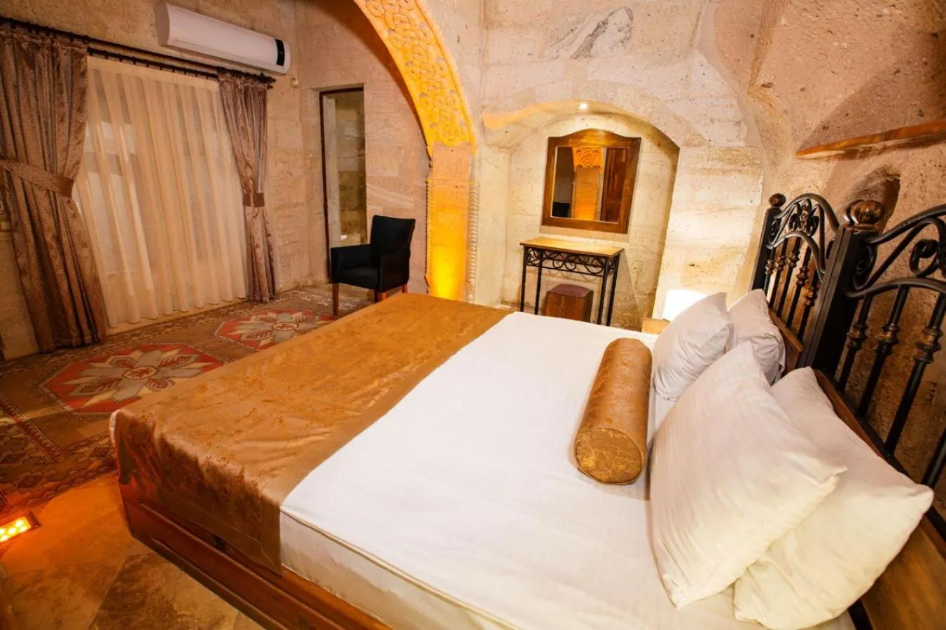 Bed in Caldera Cave Hotel