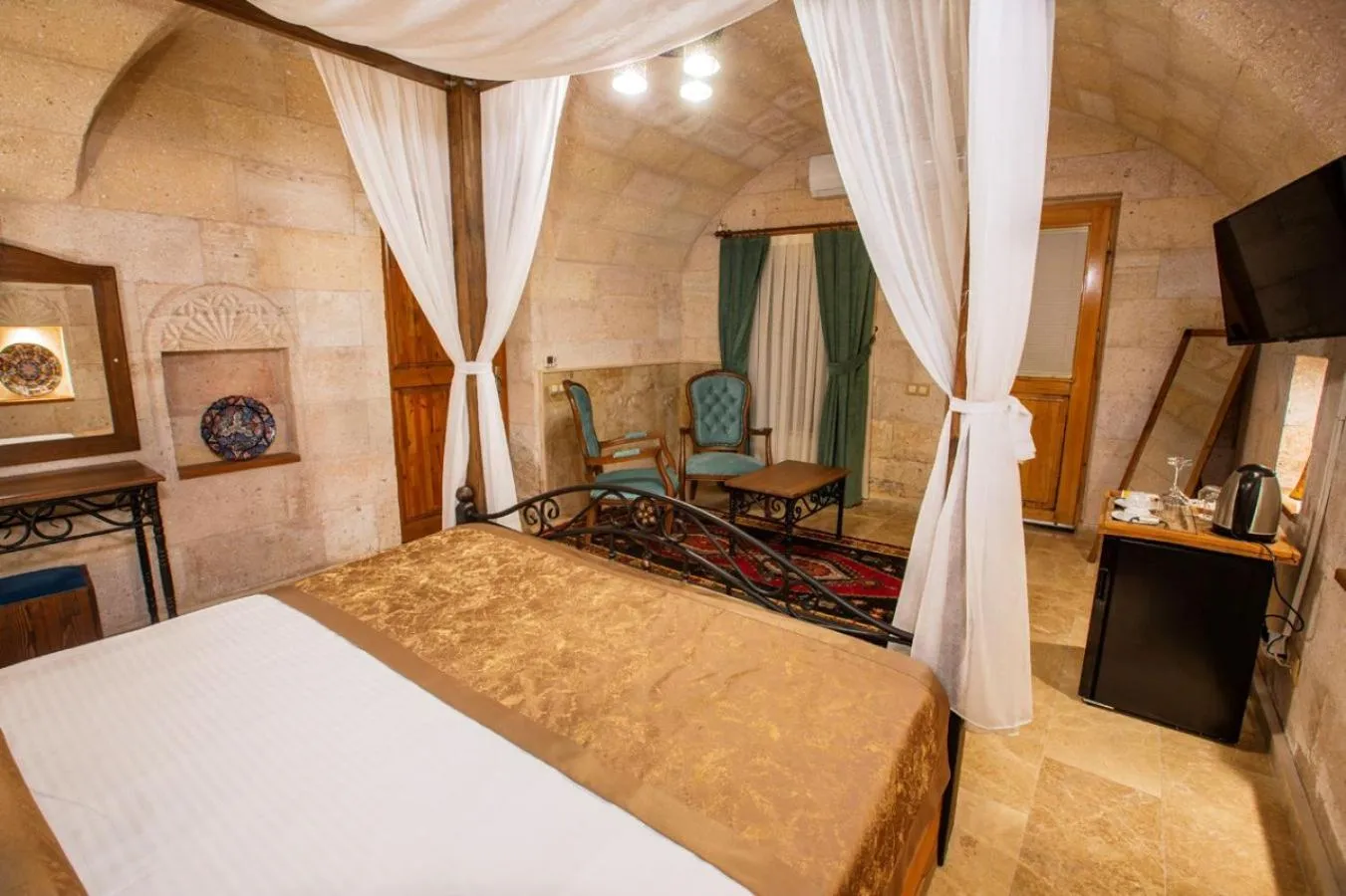 Bed in Caldera Cave Hotel