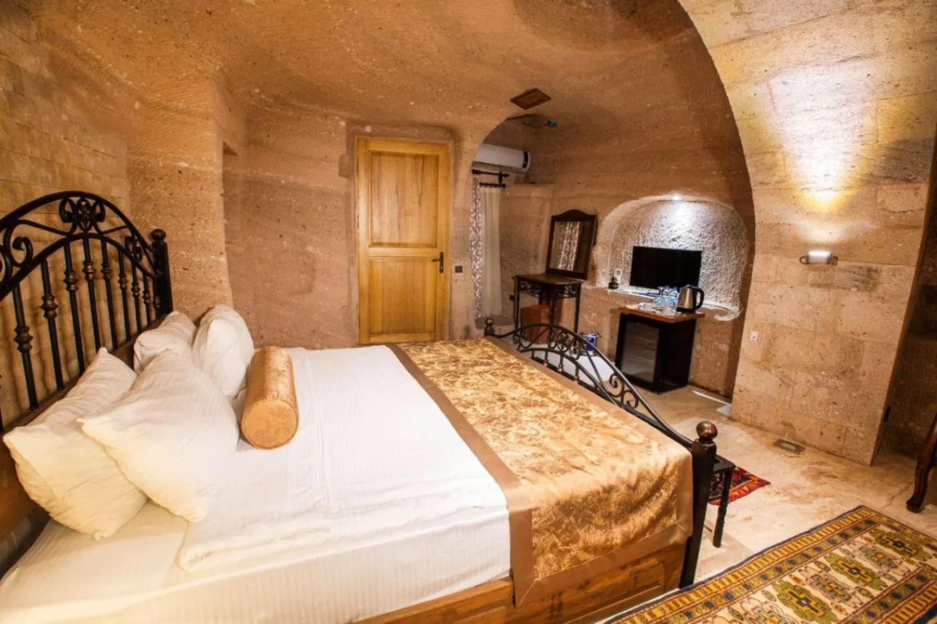 Bed in Caldera Cave Hotel