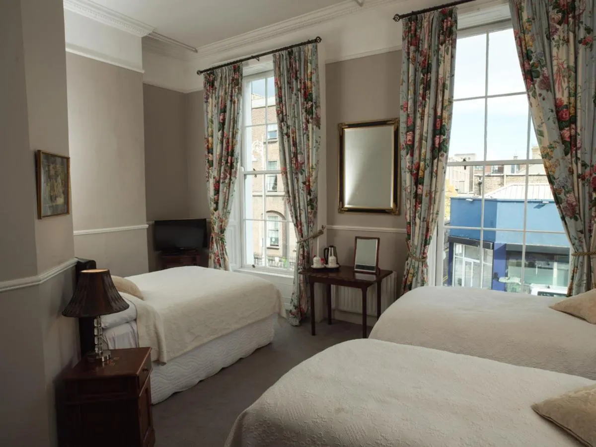 Bed in Harveys Guest House