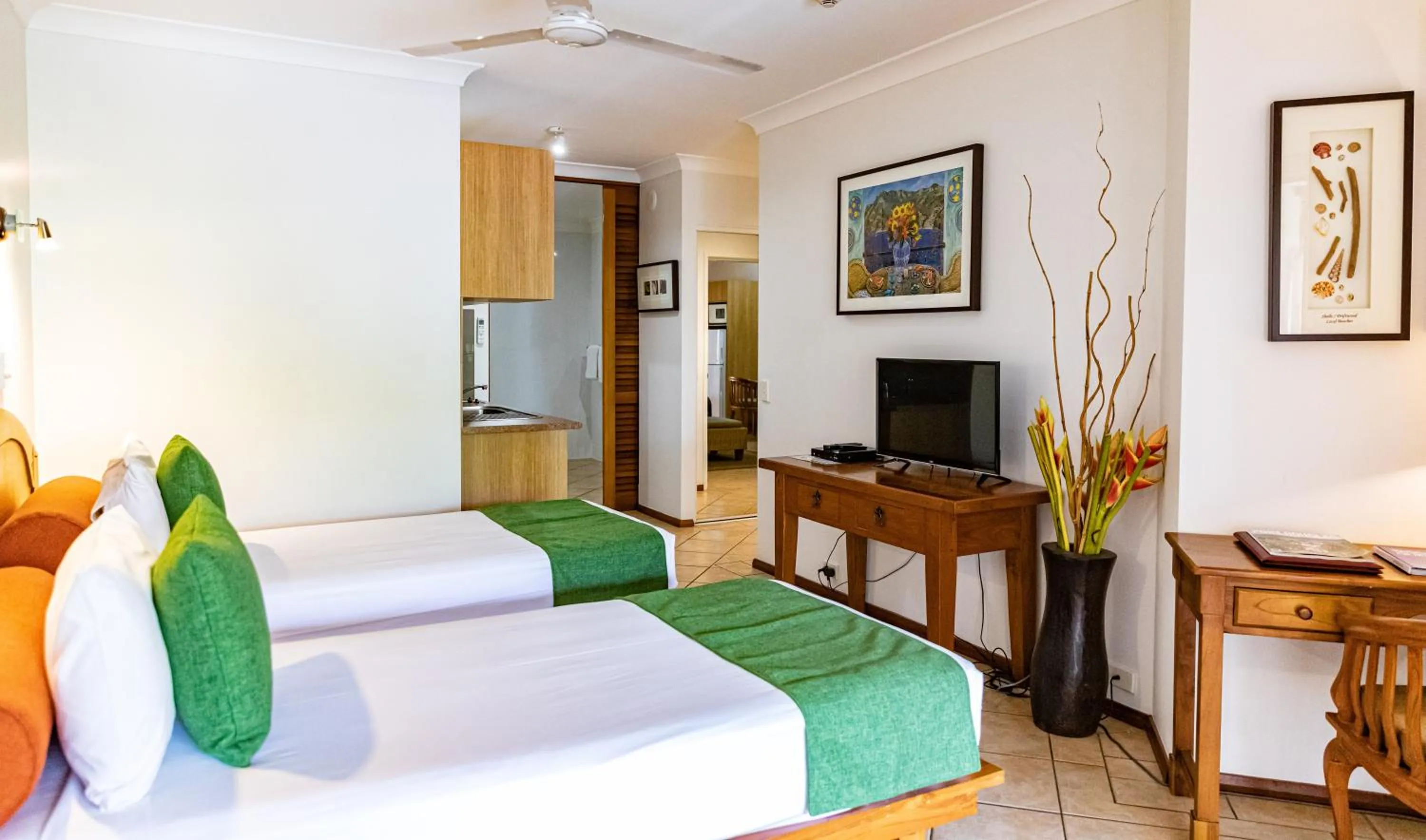 Communal lounge/ TV room, Bed in Hibiscus Resort & Spa - Official Onsite Reception & Check In