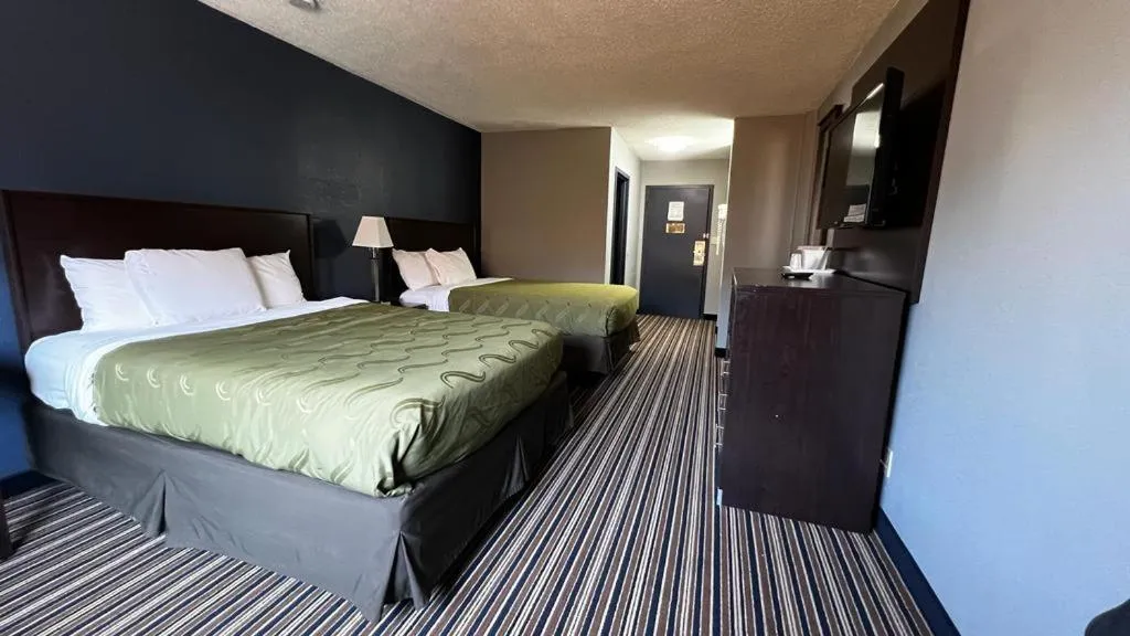 Bed in Colby Inn and Suites