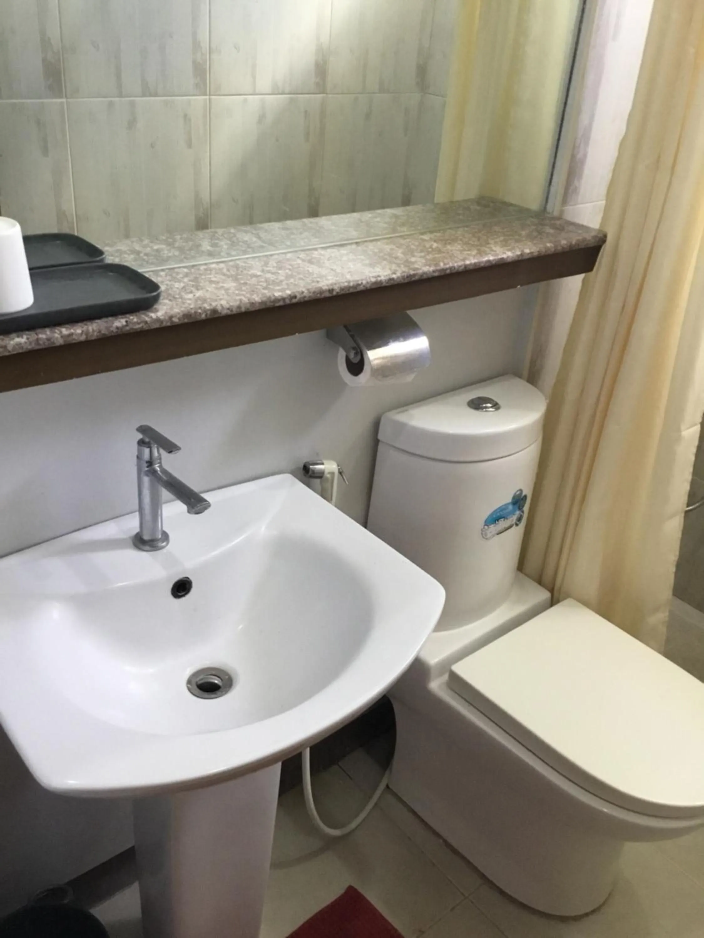 Toilet in Delle Suites