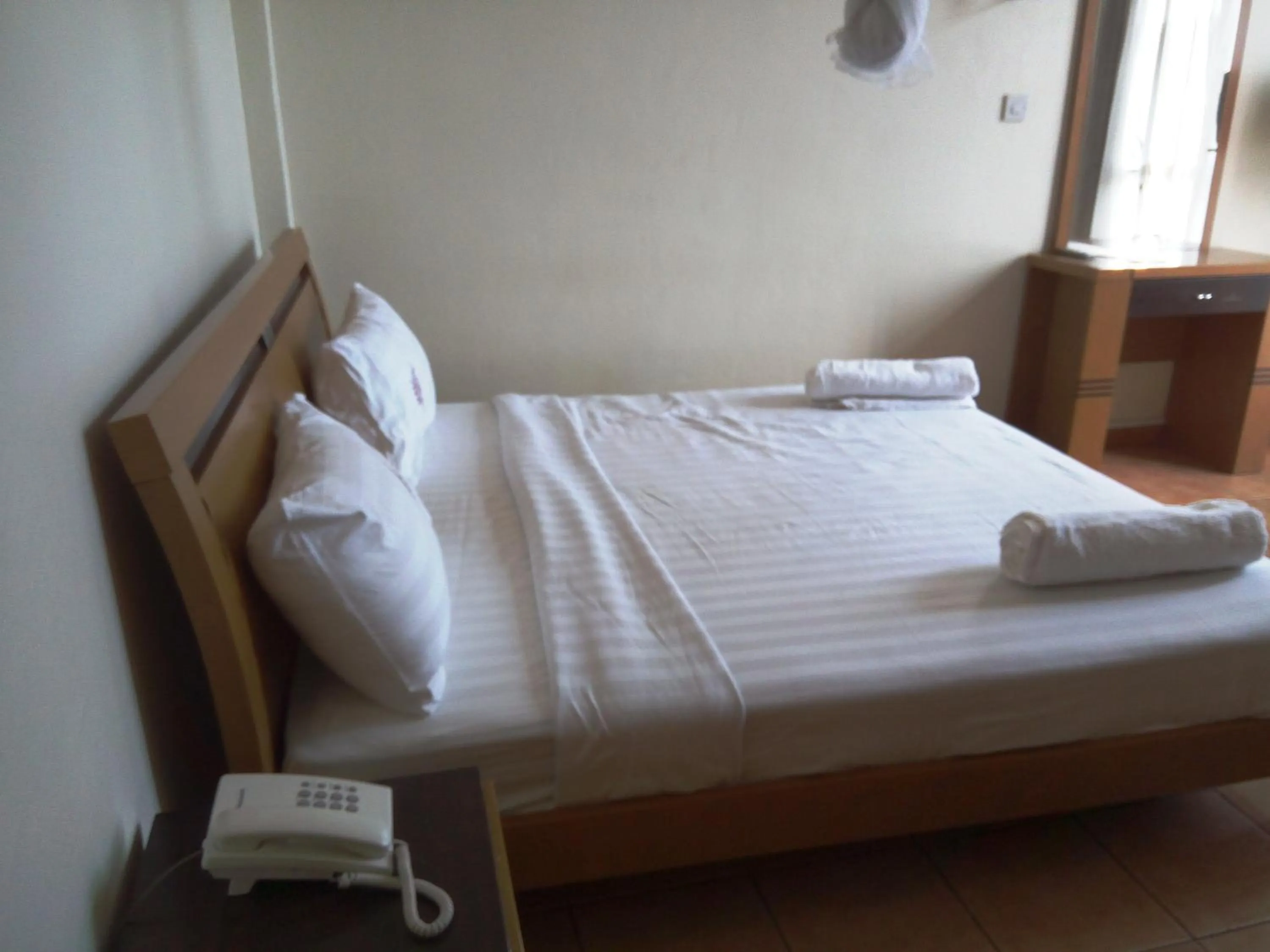 Bed in Aponye Hotel Kampala