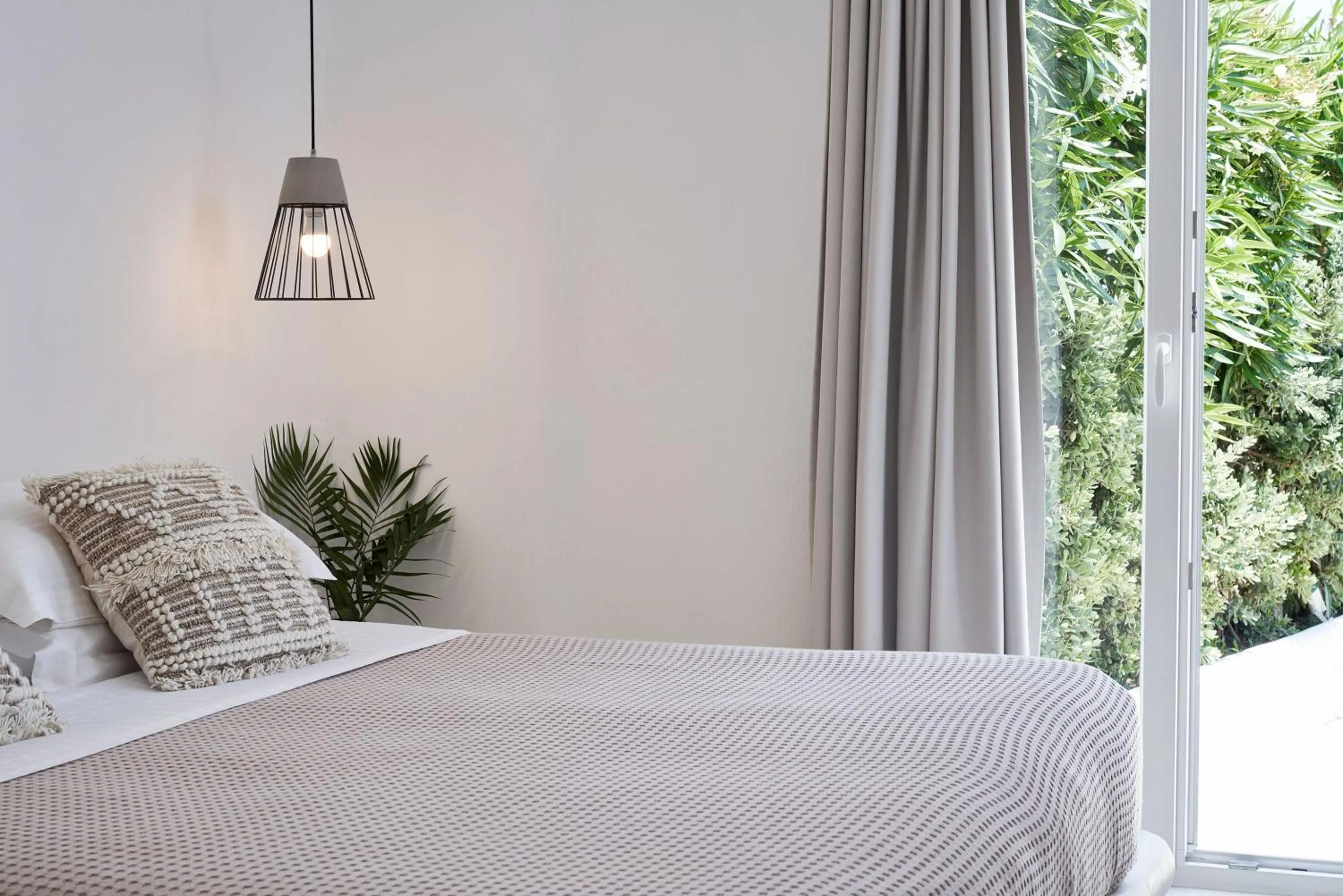 Bed in Naxian Utopia | Luxury Villas & Suites