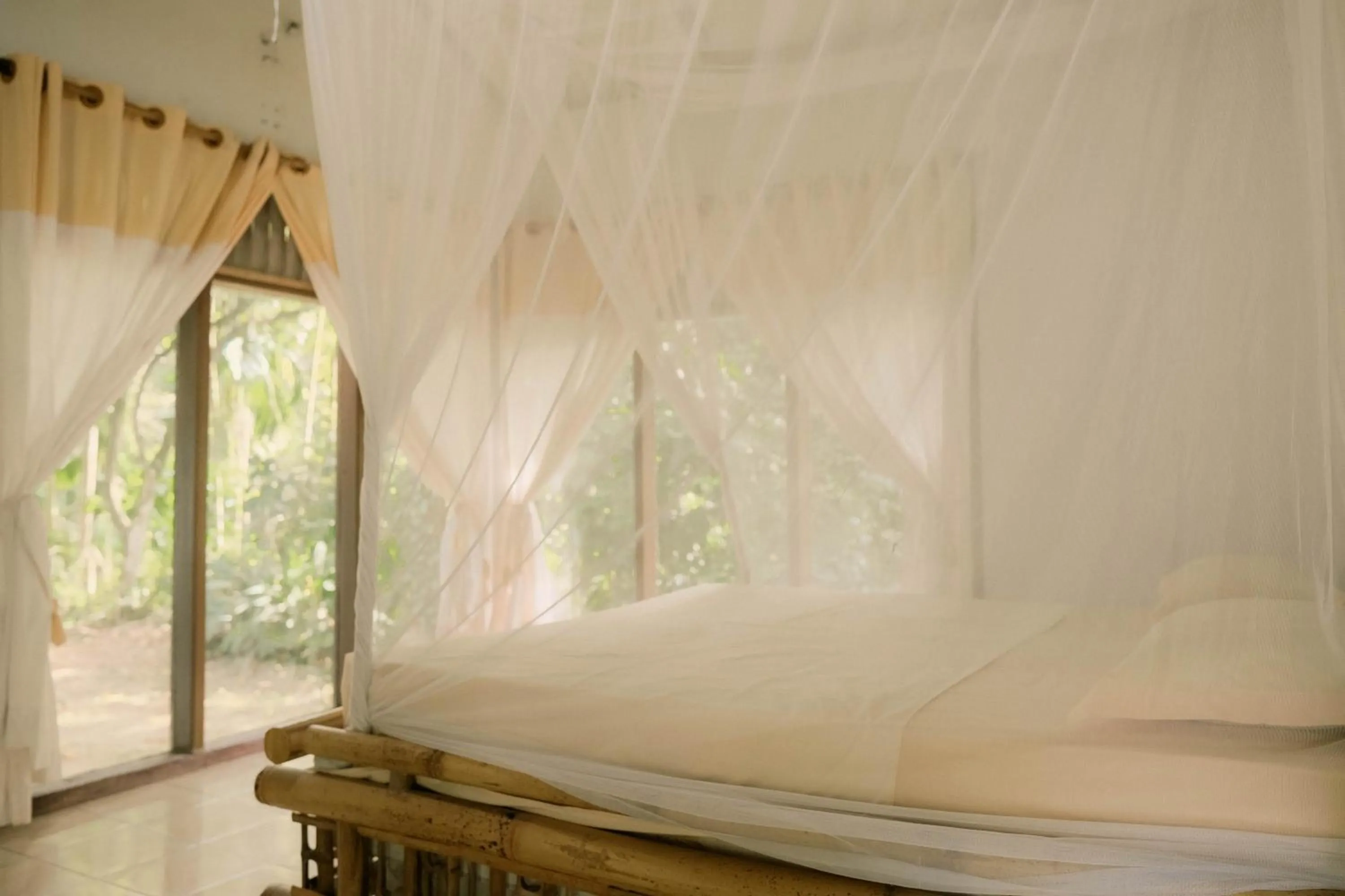 Bed in Ecolodge Bukit Lawang